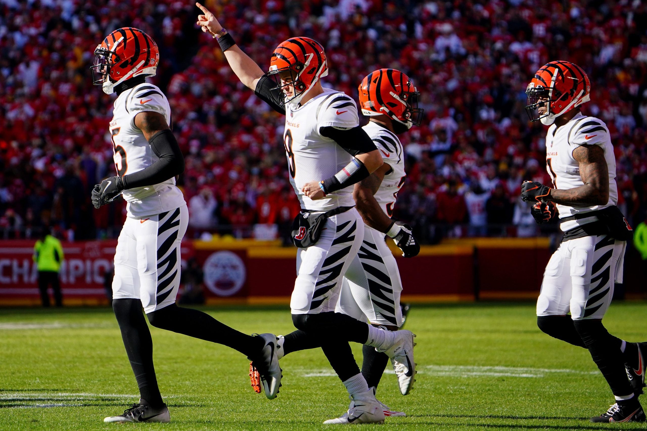 Cincinnati Bengals quarterback Joe Burrow (9) gestures as he takes the field for an offensive possession with Cincinnati Bengals wide receiver Tee Higgins (85) and Cincinnati Bengals wide receiver Ja'Marr Chase (1) in the first quarter during the AFC championship NFL football game against the Kansas City Chiefs, Sunday, Jan. 30, 2022, at GEHA Field at Arrowhead Stadium in Kansas City, Mo. Cincinnati Bengals At Kansas City Chiefs Jan 30 Afc Championship 358 Syndication The Enquirer