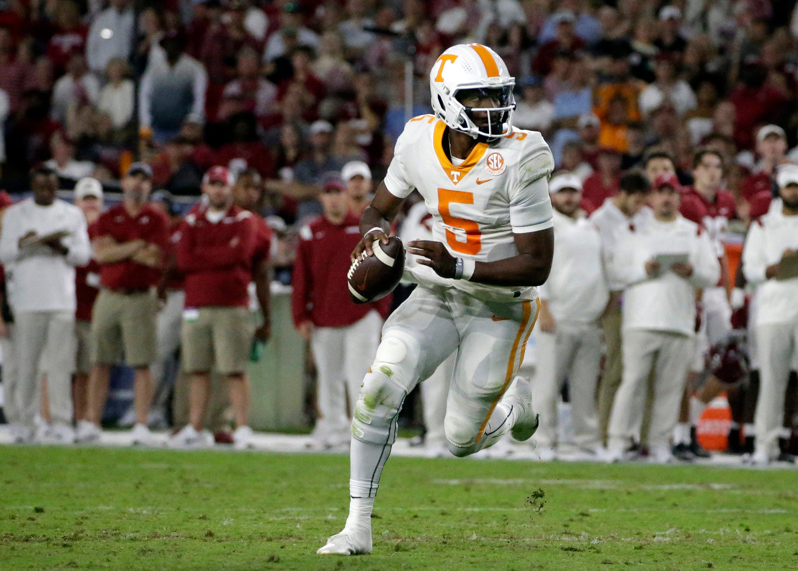 Oct 23, 2021; Tuscaloosa, Alabama, USA; Tennessee Volunteers quarterback Hendon Hooker (5) rolls out to pass against the Alabama Crimson Tide during the second half at Bryant-Denny Stadium. Mandatory Credit: Butch Dill-USA TODAY Sports