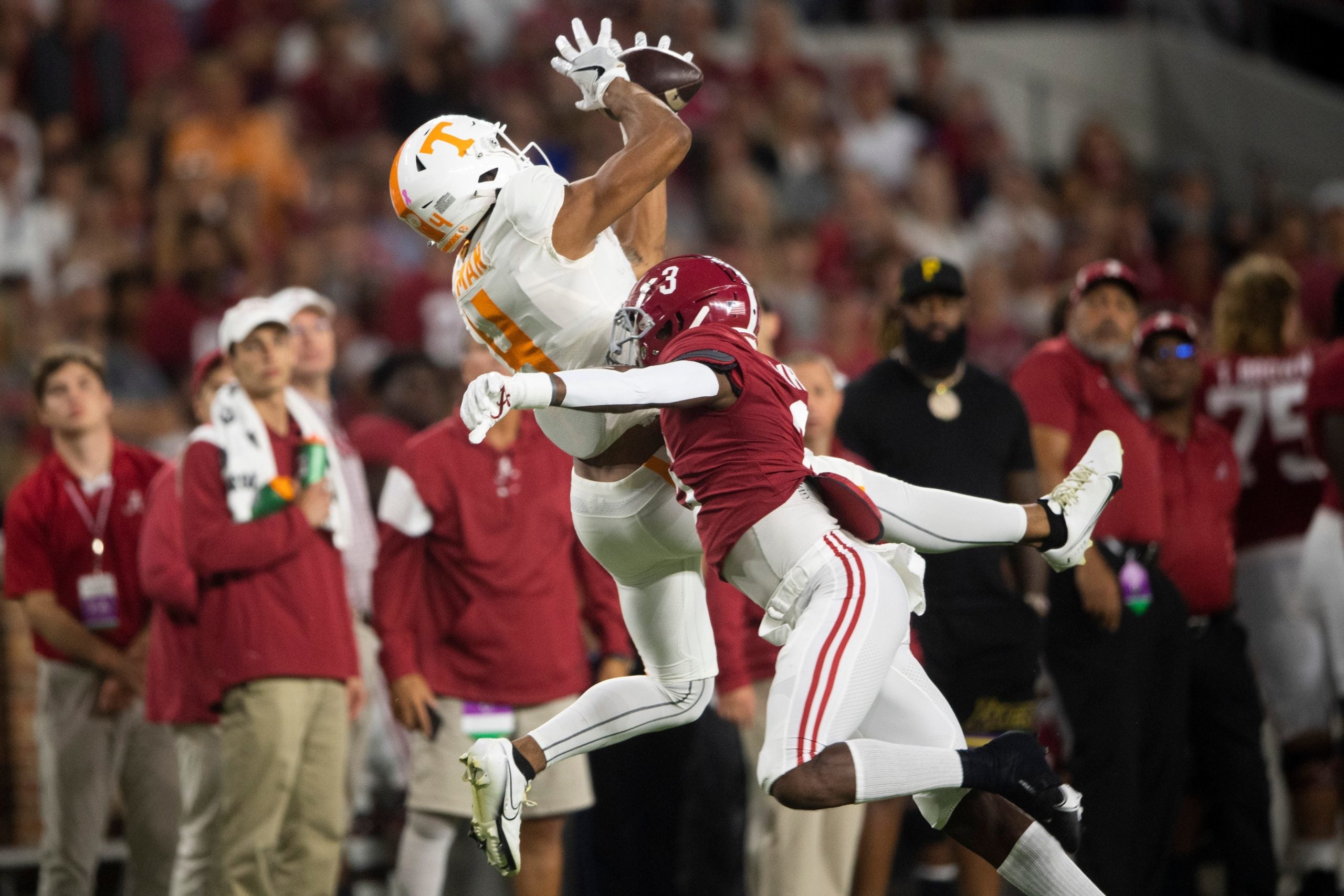 Tennessee wide receiver Cedric Tillman (4) catches a ball over Alabama defensive back Daniel Wright (3) during a football game between the Tennessee Volunteers and the Alabama Crimson Tide at Bryant-Denny Stadium in Tuscaloosa, Ala., on Saturday, Oct. 23, 2021. Kns Tennessee Alabama Football Bp