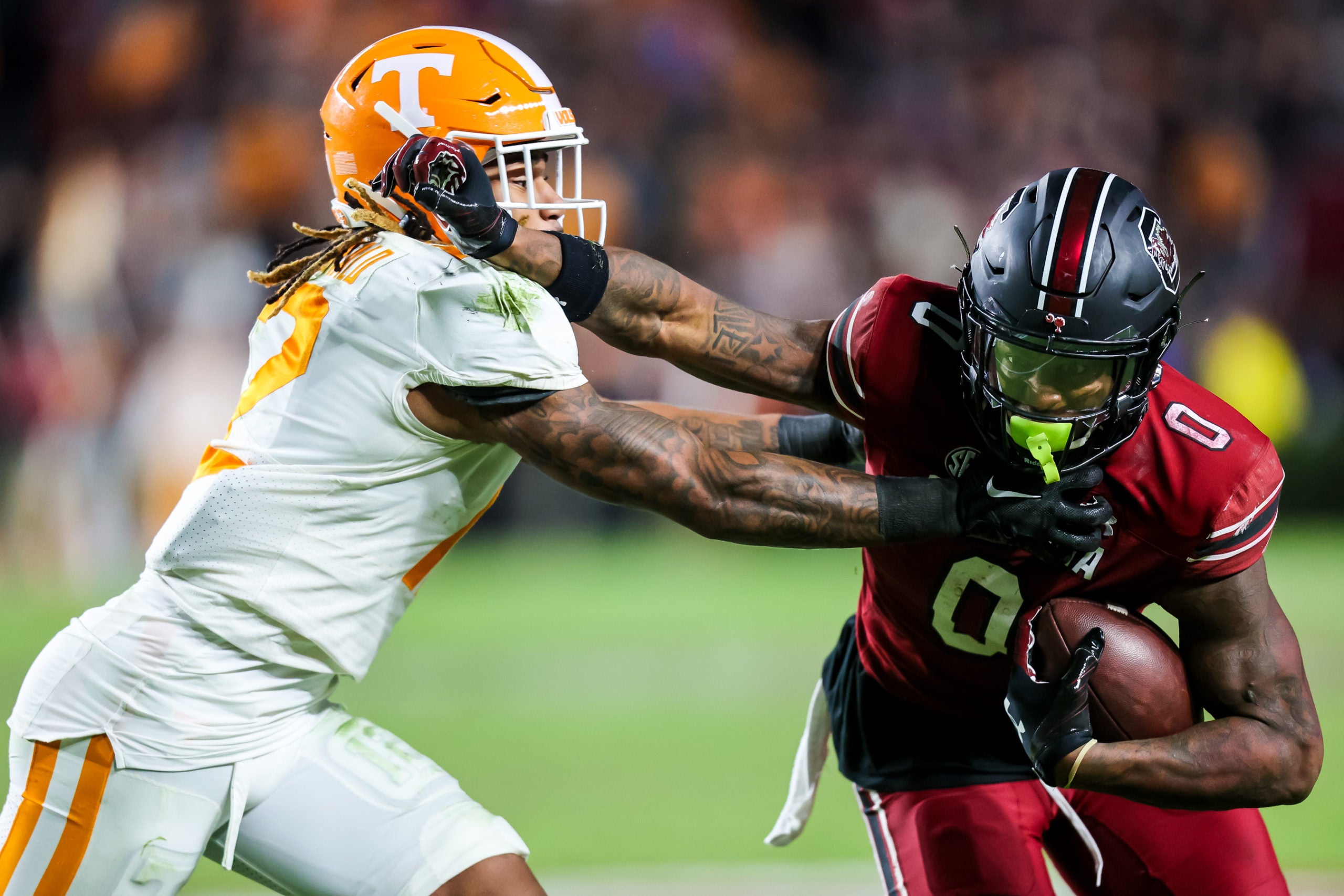 Nov 5, 2022; Athens, Georgia, USA; Tennessee Volunteers quarterback Hendon Hooker (5) looks for a receiver as he runs against the Georgia Bulldogs during the second half at Sanford Stadium. Mandatory Credit: Dale Zanine-USA TODAY Sports
