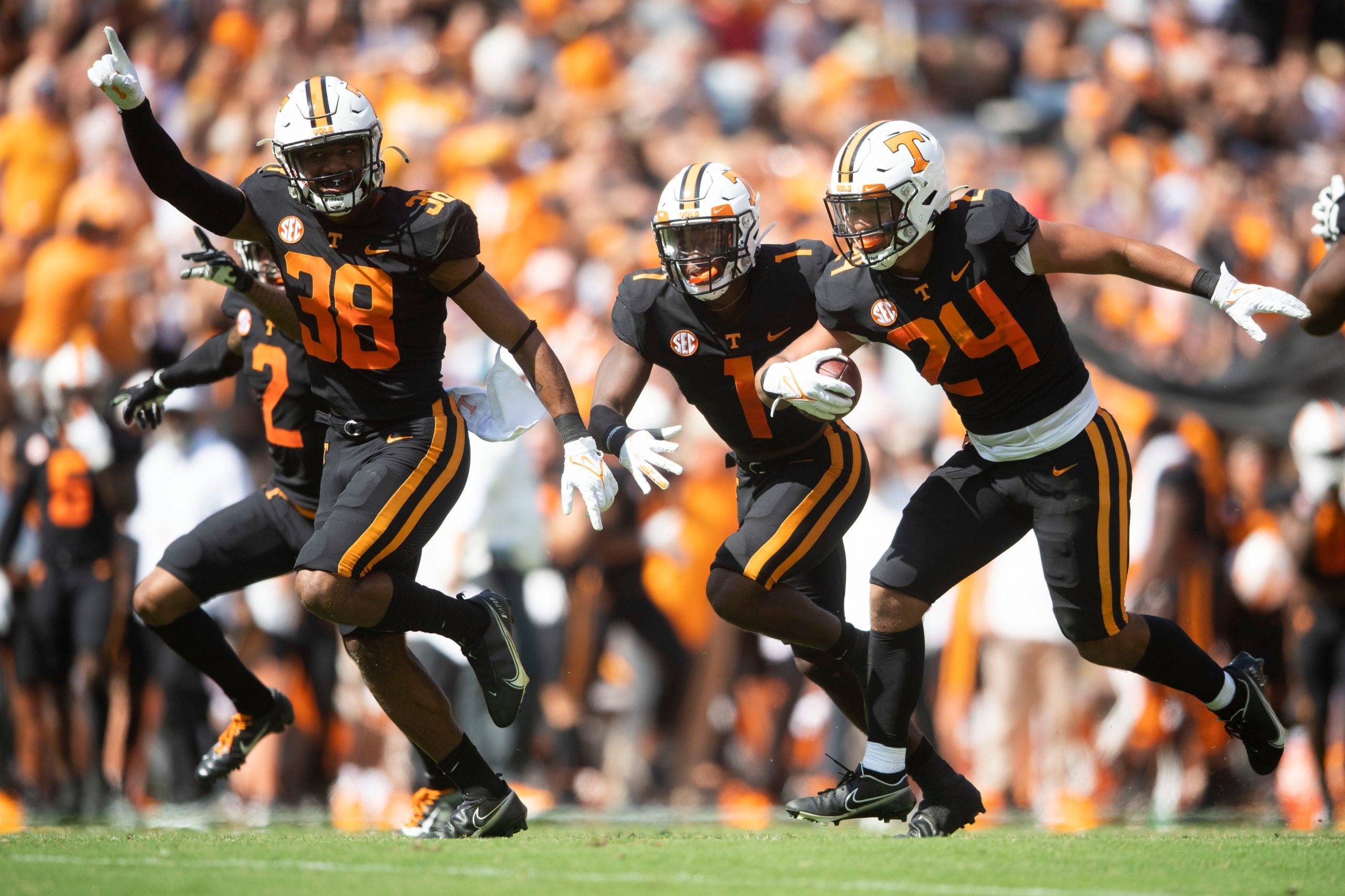 Oct 9, 2021; Knoxville, TN, USA;  From left, Tennessee linebacker Solon Page III (38), defensive back Trevon Flowers (1), and linebacker Aaron Beasley (24) celebrate a fumble recovery against South Carolina in the NCAA college football game between the Tennessee Volunteers and the South Carolina Gamecocks in Knoxville, Tenn. on Saturday, October 9, 2021. Mandatory Credit: Brianna Paciorka-USA TODAY Sports