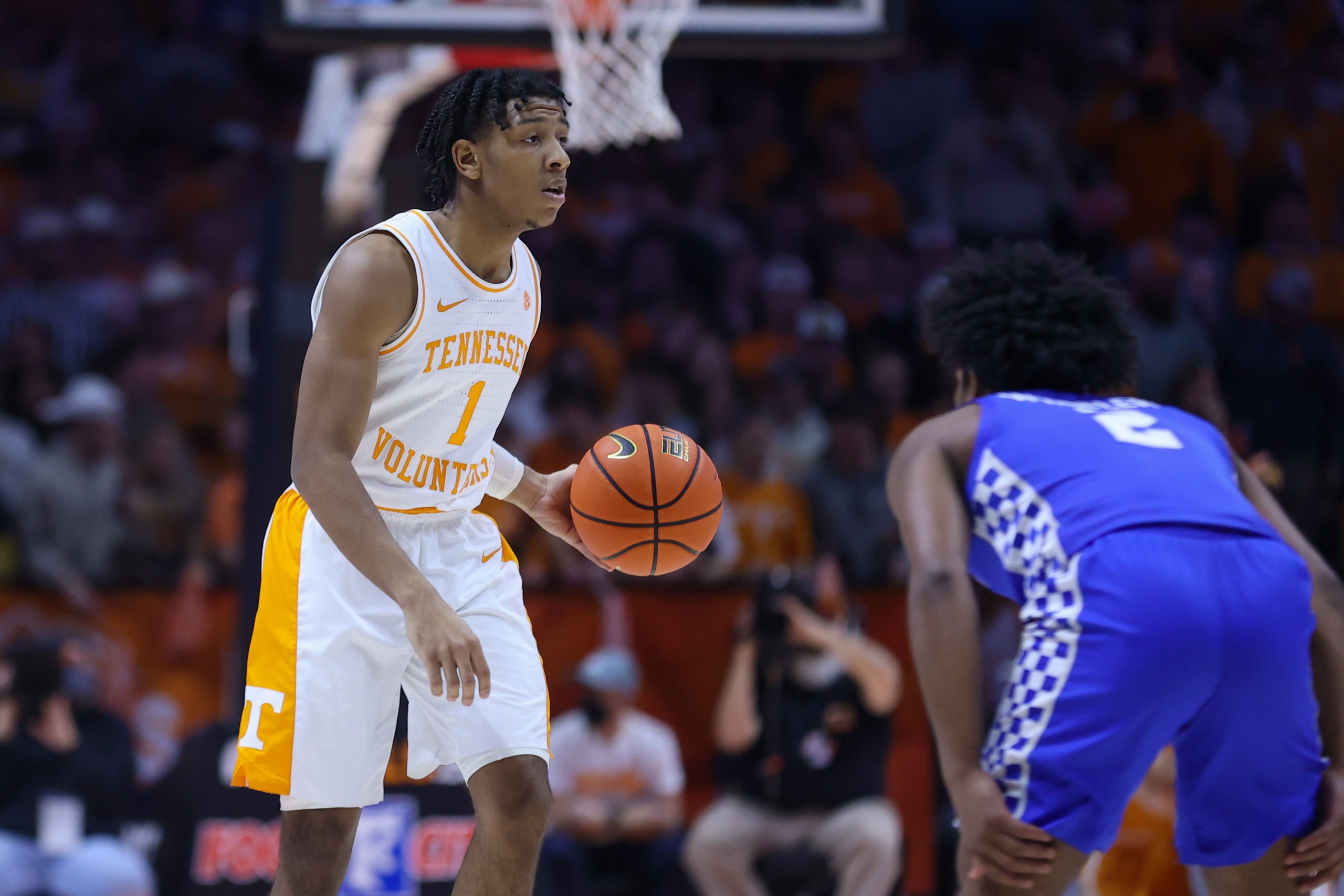 Feb 15, 2022; Knoxville, Tennessee, USA; Tennessee Volunteers guard Kennedy Chandler (1) brings the ball up court against Kentucky Wildcats guard Sahvir Wheeler (2) during the first half at Thompson-Boling Arena. Mandatory Credit: Randy Sartin-USA TODAY Sports