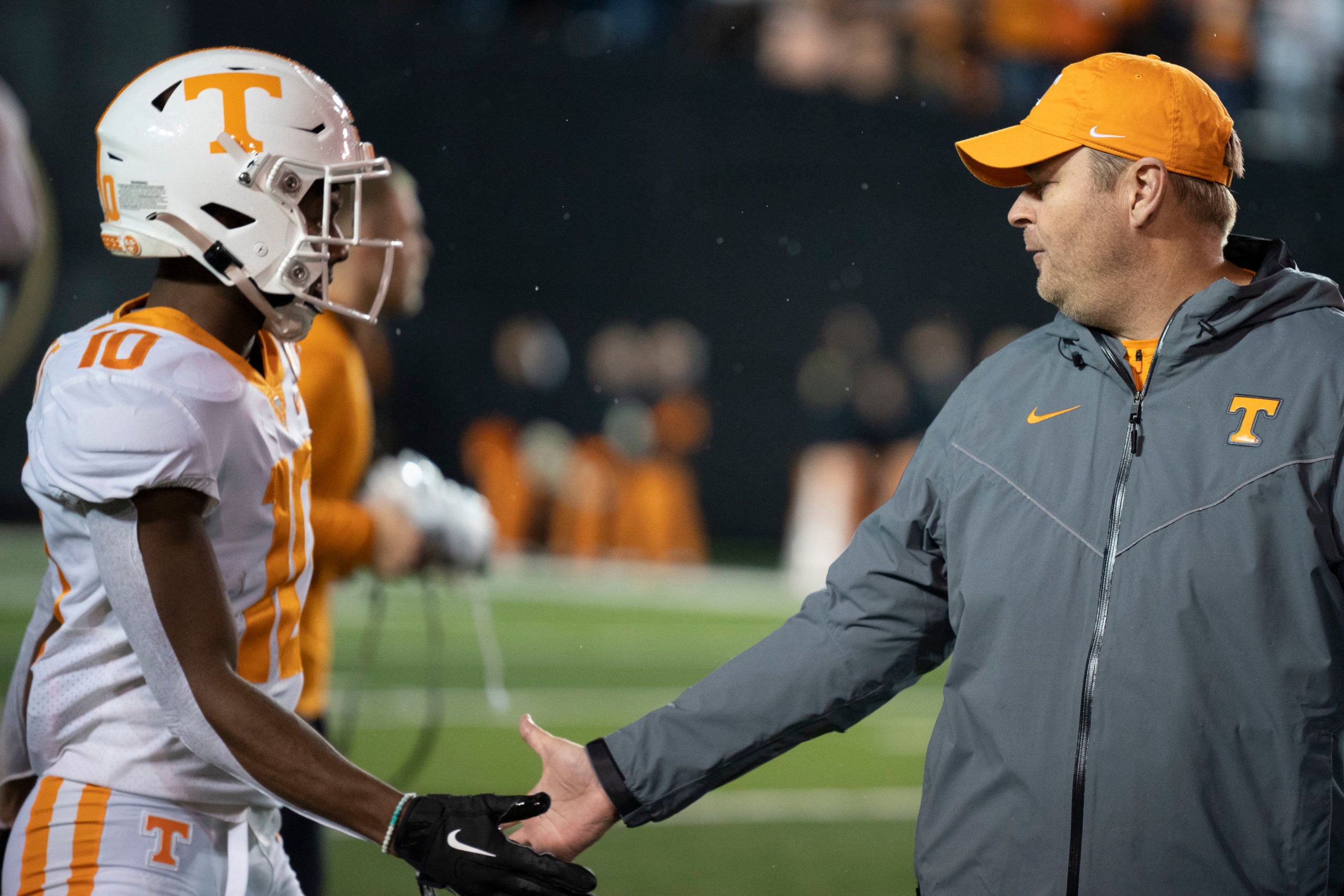 Nov 26, 2022; Nashville, Tennessee, USA; Tennessee Volunteers head coach Josh Heupel shakes hands with wide receiver Squirrel White (10) before a game against the the Vanderbilt Commodores at FirstBank Stadium.  Mandatory Credit: George Walker IV - USA TODAY Sports