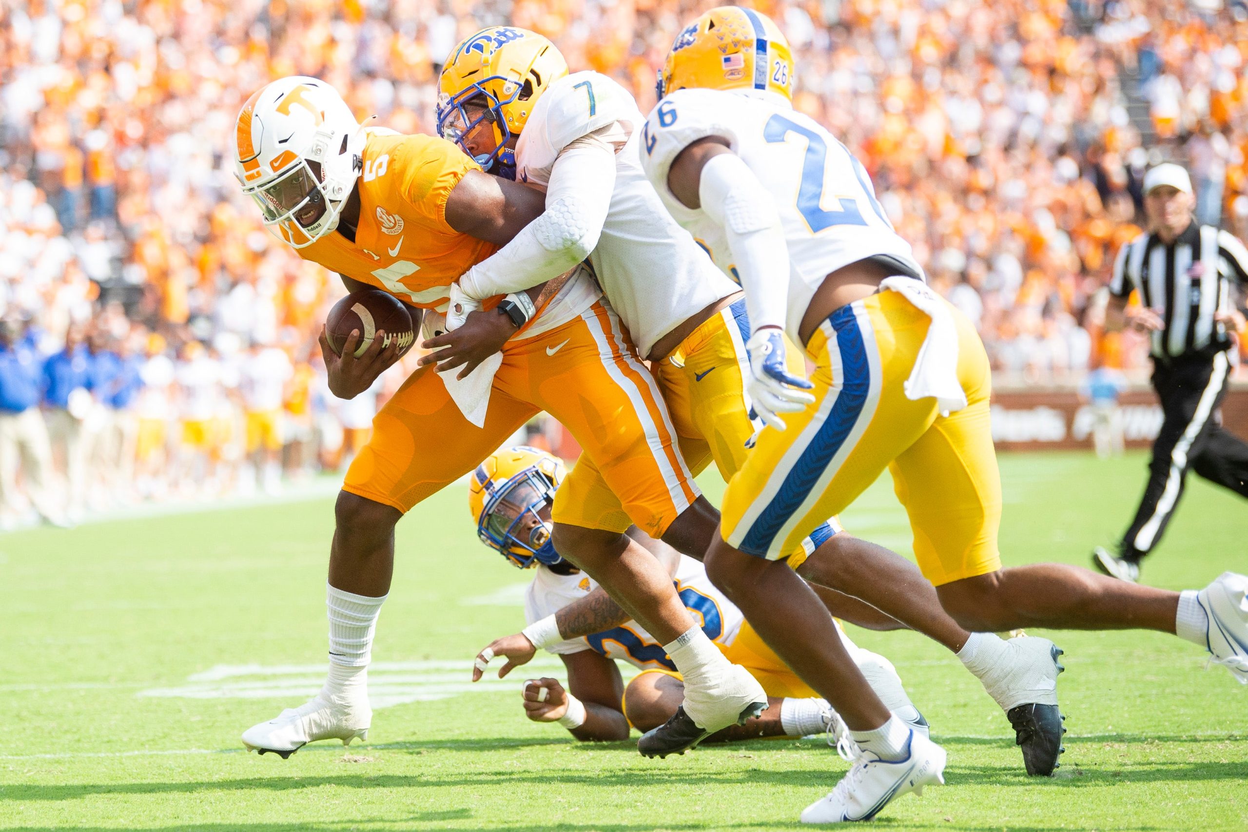 Tennessee quarterback Hendon Hooker (5) is brought down by Pittsburgh linebacker SirVocea Dennis (7) during a football game between the Tennessee Volunteers and the Pittsburgh Panthers in Neyland Stadium on Saturday, Sept. 11, 2021. Kns Ut Pitt Footbal Bp