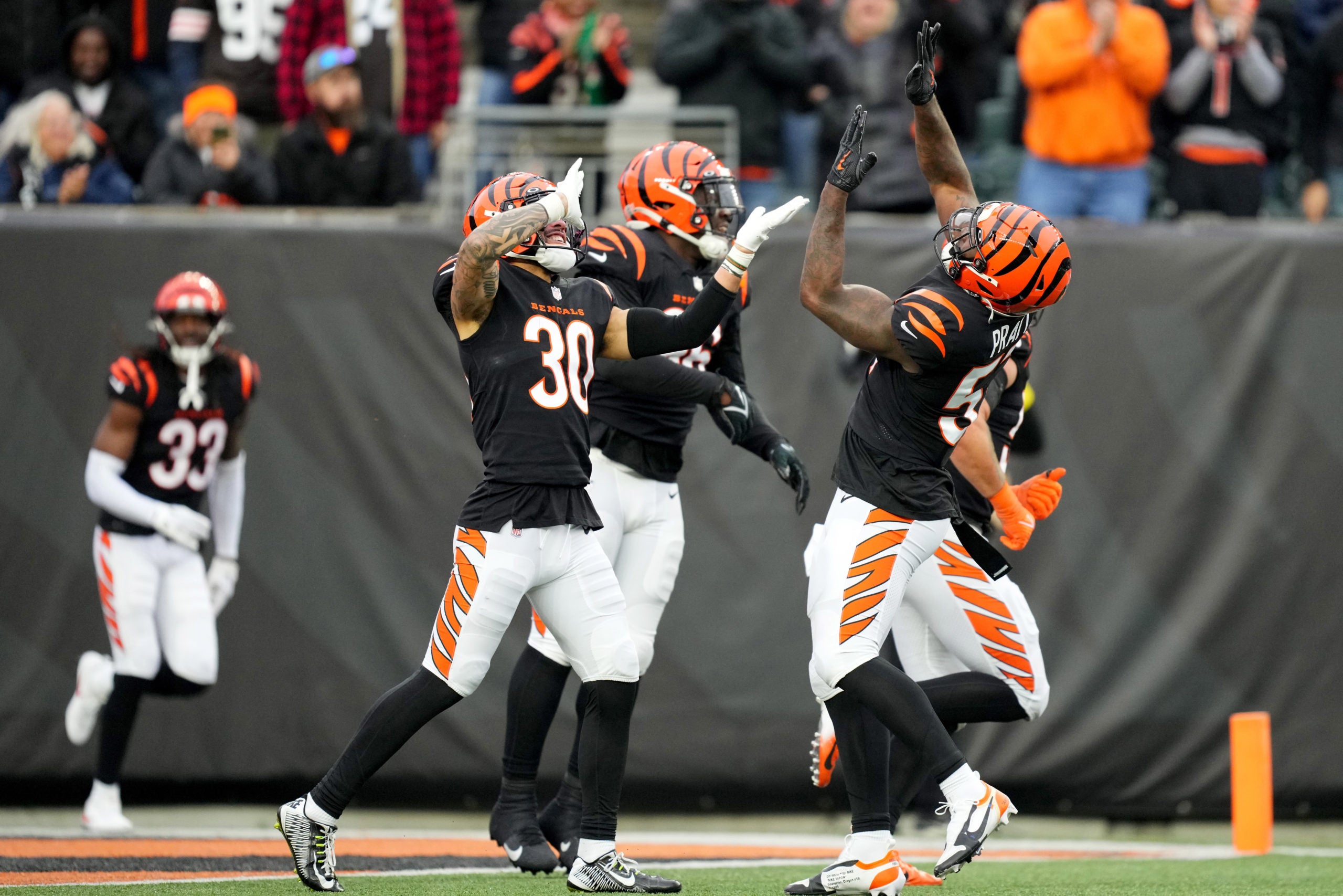 Dec 11, 2022; Cincinnati, Ohio, USA; Cincinnati Bengals safety Jessie Bates III (30) and Cincinnati Bengals linebacker Germaine Pratt (57) celebrate an interception in the fourth quarter during a Week 14 NFL game against the Cleveland Browns, Sunday, Dec. 11, 2022, at Paycor Stadium in Cincinnati. The Cincinnati Bengals won, 23-10. Mandatory Credit: Kareem Elgazzar-USA TODAY Sports