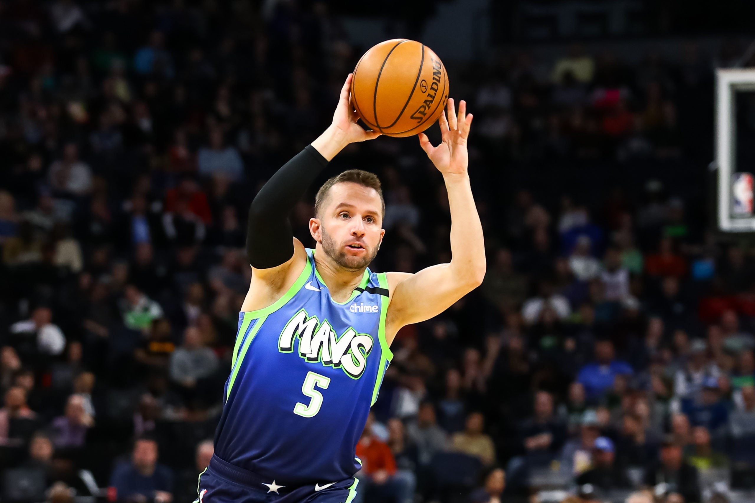 Mar 1, 2020; Minneapolis, Minnesota, USA; Dallas Mavericks guard J.J. Barea (5) passes the ball against the Minnesota Timberwolves in the first quarter at Target Center. Mandatory Credit: David Berding-USA TODAY Sports