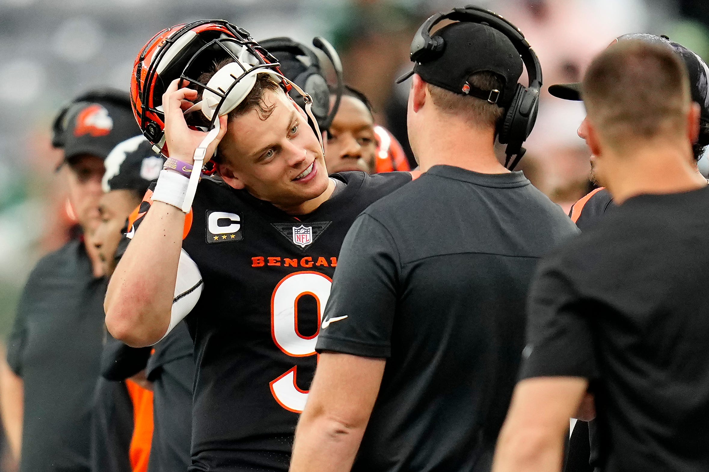 Cincinnati Bengals quarterback Joe Burrow (9) and head coach Zac Taylor talk as the offense comes off the field in the fourth quarter of the NFL Week 3 game between the New York Jets and the Cincinnati Bengals at MetLife Stadium in East Rutherford, N.J., on Sunday, Sept. 25, 2022. The Bengals improved to 1-2 on the season with a 27-12 win over the Jets. Cincinnati Bengals At New York Jets Week 3