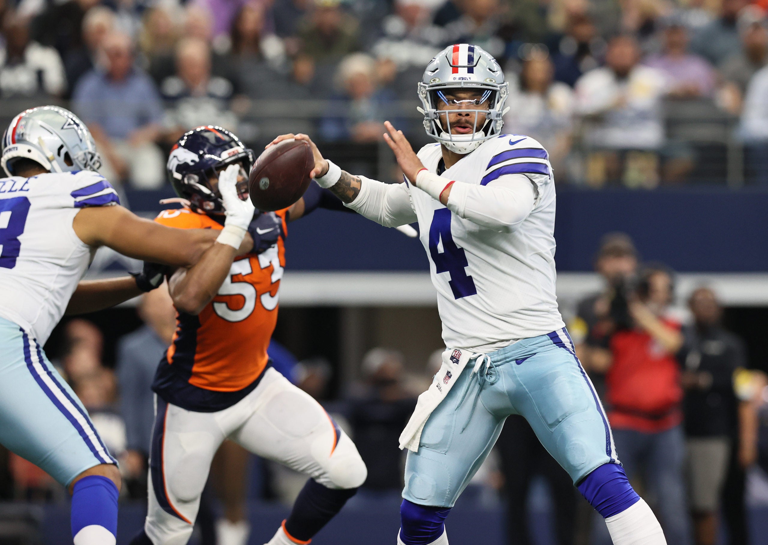 Nov 7, 2021; Arlington, Texas, USA; Dallas Cowboys quarterback Dak Prescott (4) throws in the pocket in the second quarter against the Denver Broncos at AT&T Stadium. Mandatory Credit: Matthew Emmons-USA TODAY Sports