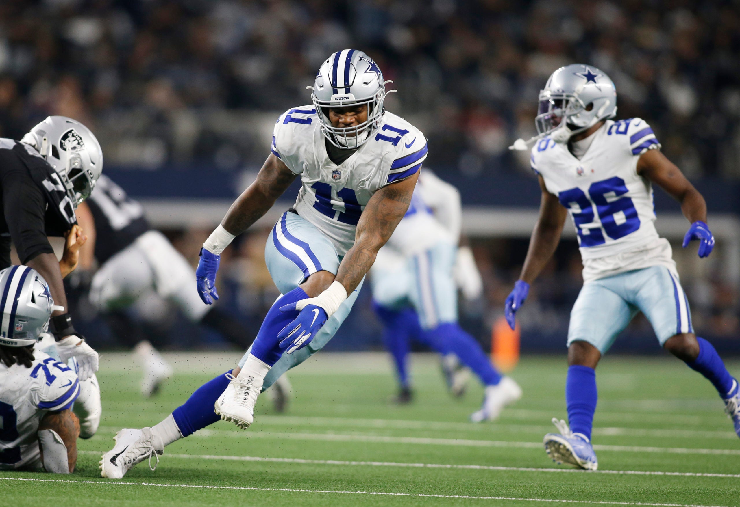 Nov 25, 2021; Arlington, Texas, USA; Dallas Cowboys outside linebacker Micah Parsons (11) in game action in the game against the Las Vegas Raiders at AT&T Stadium. Mandatory Credit: Tim Heitman-USA TODAY Sports