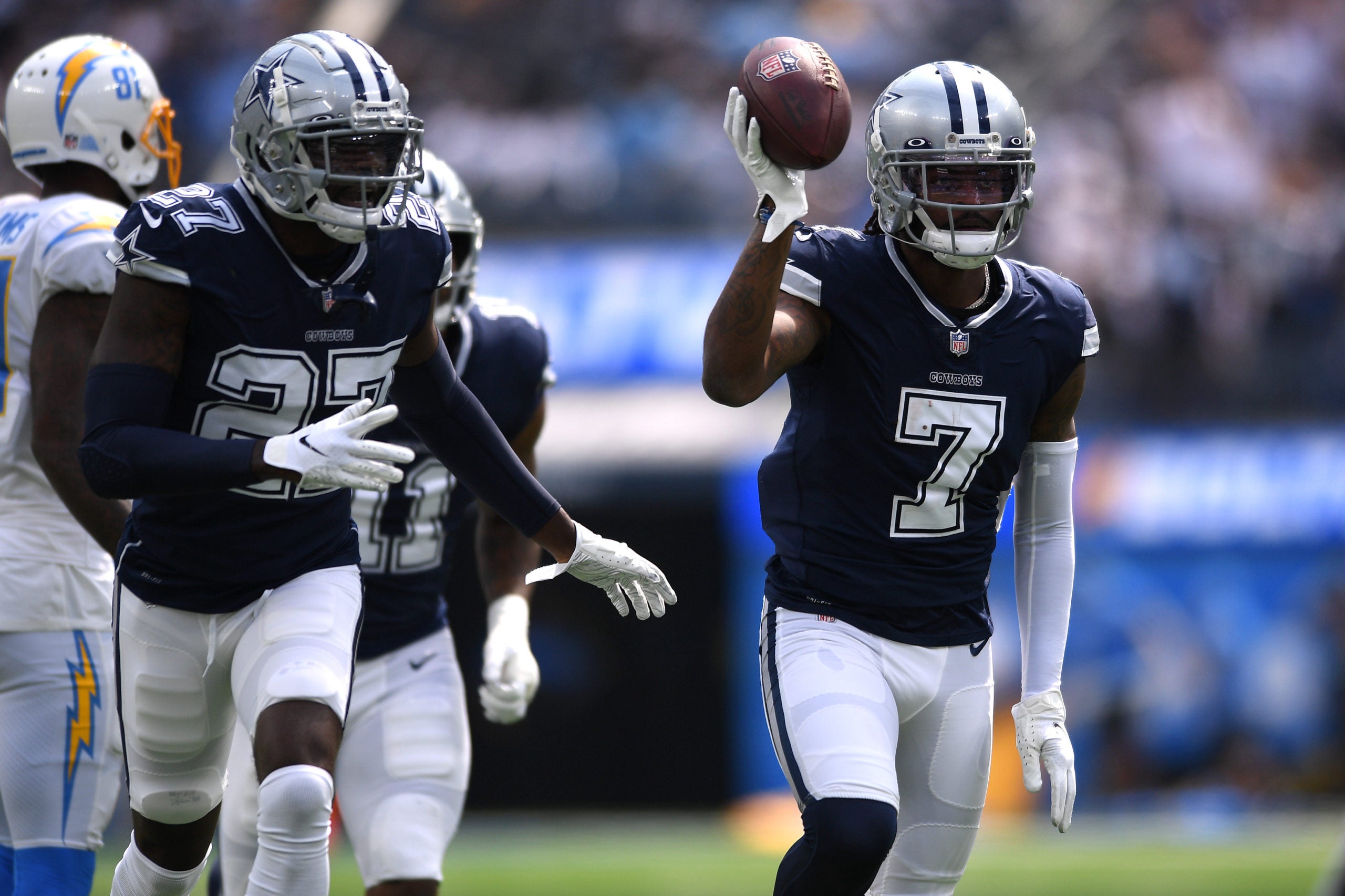Sep 19, 2021; Inglewood, California, USA; Dallas Cowboys cornerback Trevon Diggs (7) celebrates with teammates after an interception against the Los Angeles Chargers during the first quarter at SoFi Stadium. Mandatory Credit: Orlando Ramirez-USA TODAY Sports