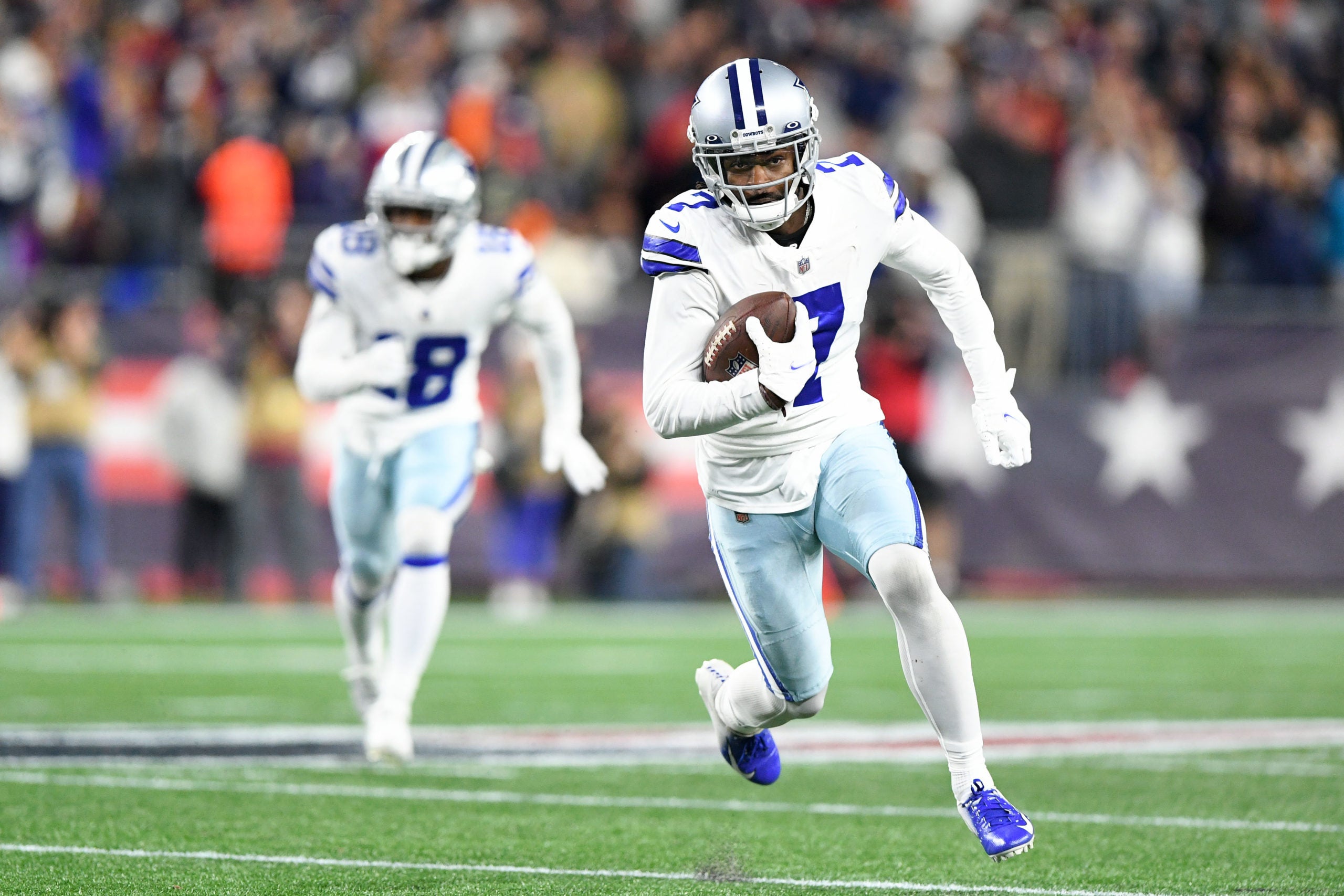 Oct 17, 2021; Foxborough, Massachusetts, USA; Dallas Cowboys cornerback Trevon Diggs (7) runs for a touchdown after intercepting the ball during the second half of a game against the New England Patriots at Gillette Stadium. Mandatory Credit: Brian Fluharty-USA TODAY Sports