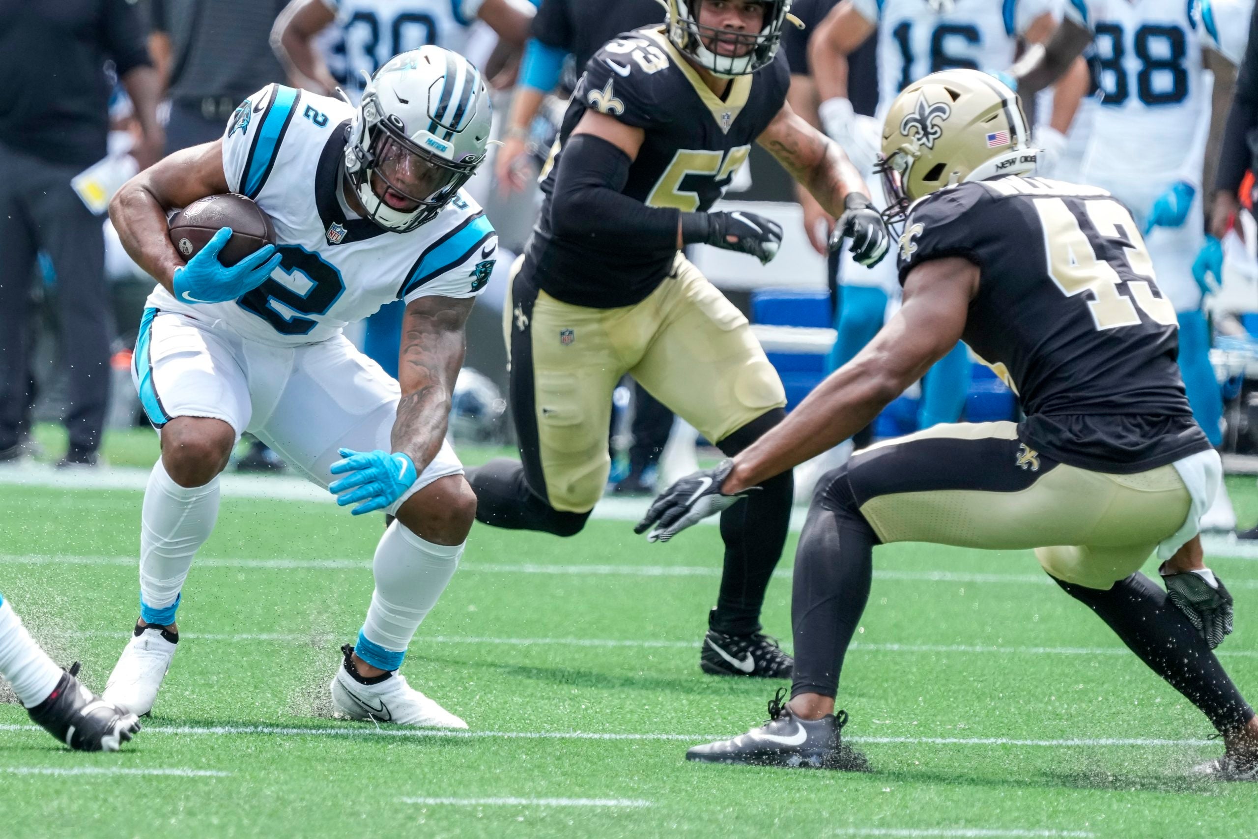 Sep 19, 2021; Charlotte, North Carolina, USA; Carolina Panthers wide receiver DJ Moore (2) tried to elude New Orleans Saints safety Marcus Williams (43) during the first quarter at Bank of America Stadium. Mandatory Credit: Jim Dedmon-USA TODAY Sports