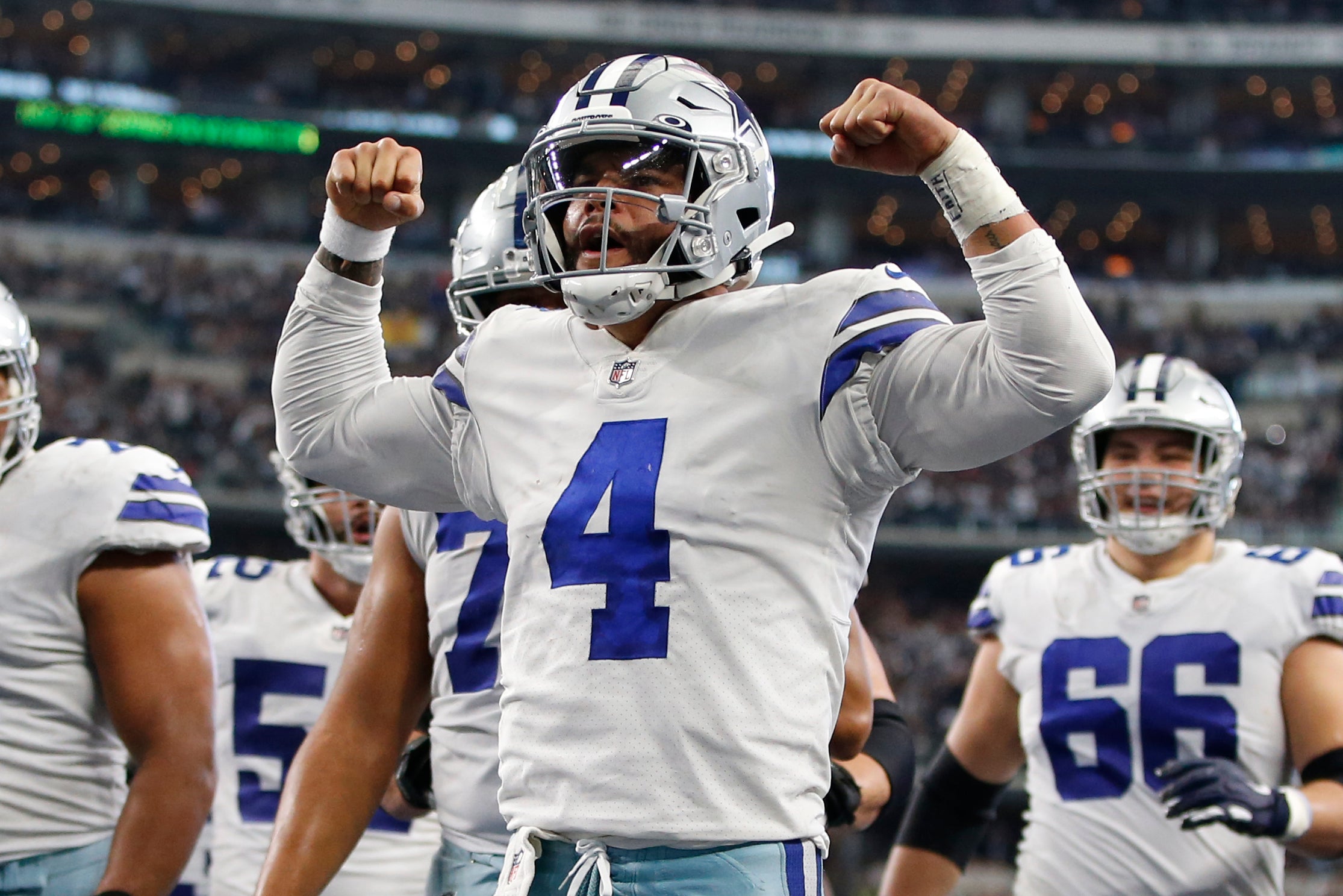 Nov 14, 2021; Arlington, Texas, USA;  Dallas Cowboys quarterback Dak Prescott (4) celebrates scoring a touchdown in the third quarter against the Atlanta Falcons at AT&T Stadium. Mandatory Credit: Tim Heitman-USA TODAY Sports