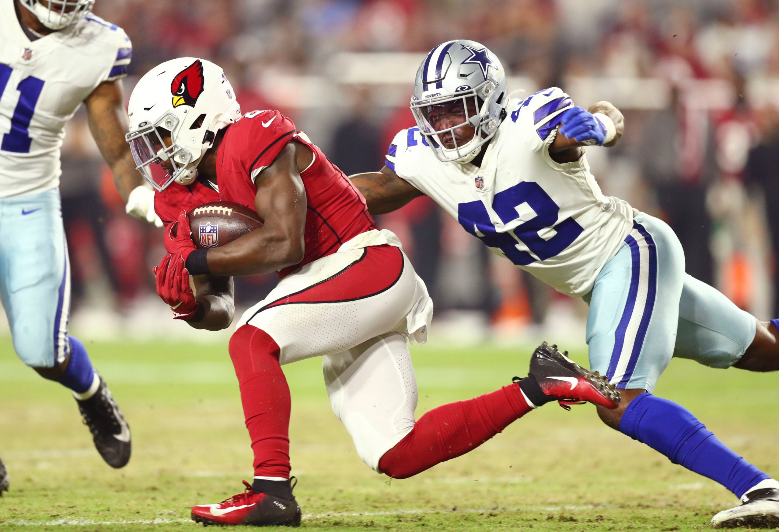 Aug 13, 2021; Glendale, Arizona, USA; Arizona Cardinals running back Chase Edmonds (2) runs the ball against Dallas Cowboys linebacker Keanu Neal (42) in the first half at State Farm Stadium. Mandatory Credit: Billy Hardiman-USA TODAY Sports