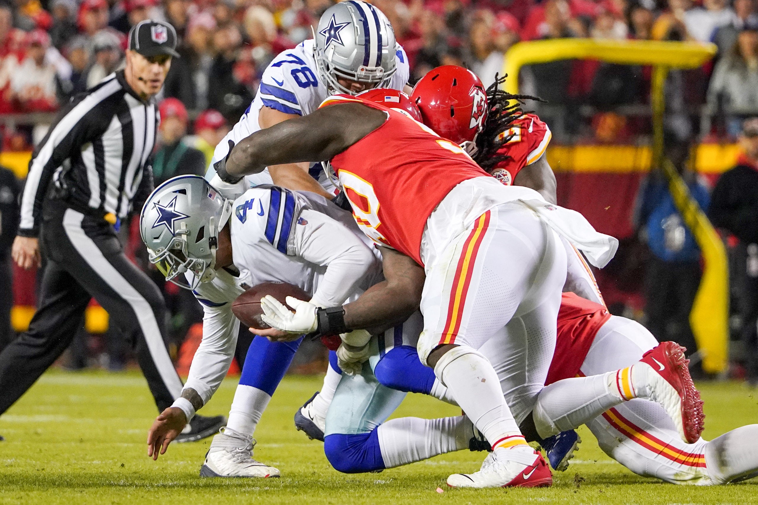 Nov 21, 2021; Kansas City, Missouri, USA; Dallas Cowboys quarterback Dak Prescott (4) is sacked by Kansas City Chiefs defensive end Chris Jones (95) during the second half at GEHA Field at Arrowhead Stadium. Mandatory Credit: Denny Medley-USA TODAY Sports