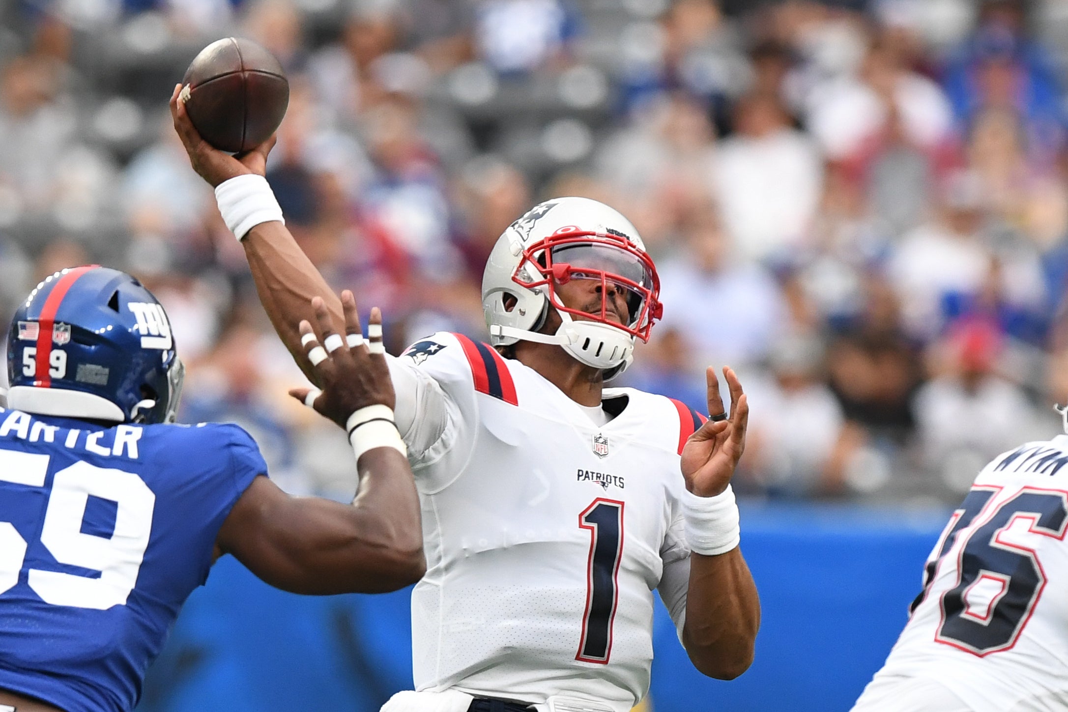 Aug 29, 2021; East Rutherford, New Jersey, USA;  New England Patriots quarterback Cam Newton (1) attempts  pass against the New York Giants at MetLife Stadium. Mandatory Credit: Dennis Schneidler-USA TODAY Sports