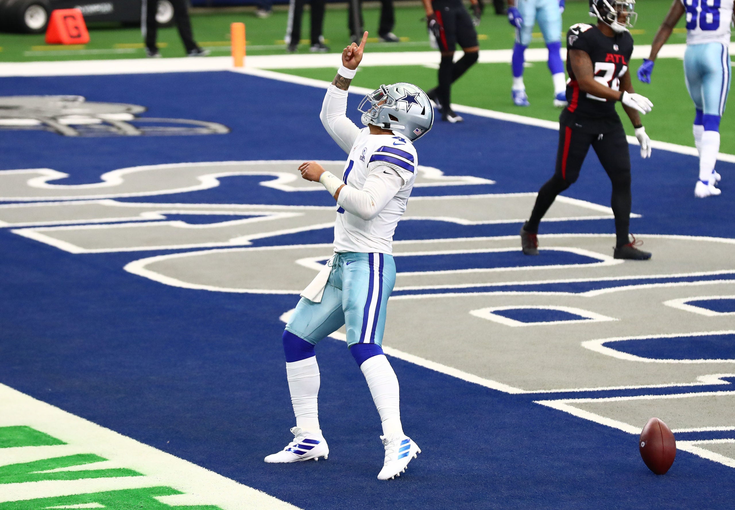 Sep 20, 2020; Arlington, Texas, USA;  Dallas Cowboys quarterback Dak Prescott (4) celebrates his third quarter touchdown against the Atlanta Falcons at AT&T Stadium. Mandatory Credit: Matthew Emmons-USA TODAY Sports