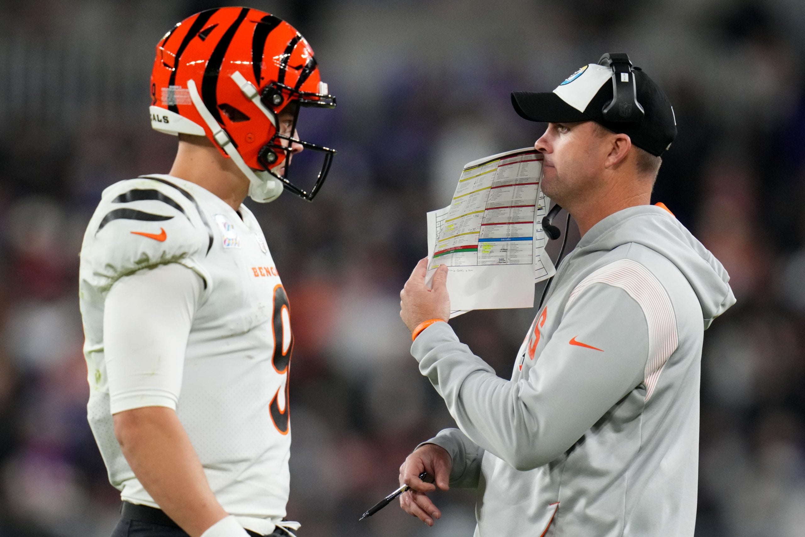 Cincinnati Bengals head coach Zac Taylor talks to Cincinnati Bengals quarterback Joe Burrow (9) in the fourth quarter during an NFL Week 5 game against the Baltimore Ravens, Sunday, Oct. 9, 2022, at M&T Bank Stadium in Baltimore. Nfl Cincinnati Bengals At Baltimore Ravens Oct 9 0340