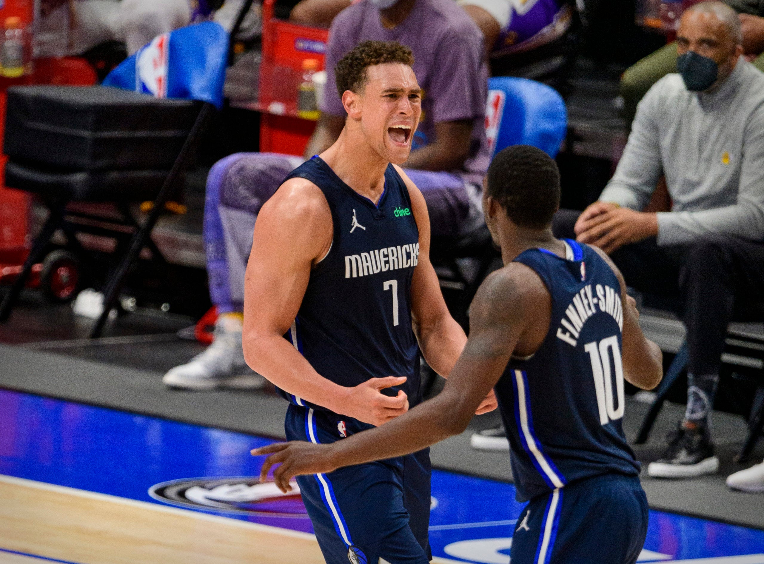 Apr 24, 2021; Dallas, Texas, USA; Dallas Mavericks center Dwight Powell (7) and forward Dorian Finney-Smith (10) celebrates during the fourth quarter against the Los Angeles Lakers at the American Airlines Center. Mandatory Credit: Jerome Miron-USA TODAY Sports