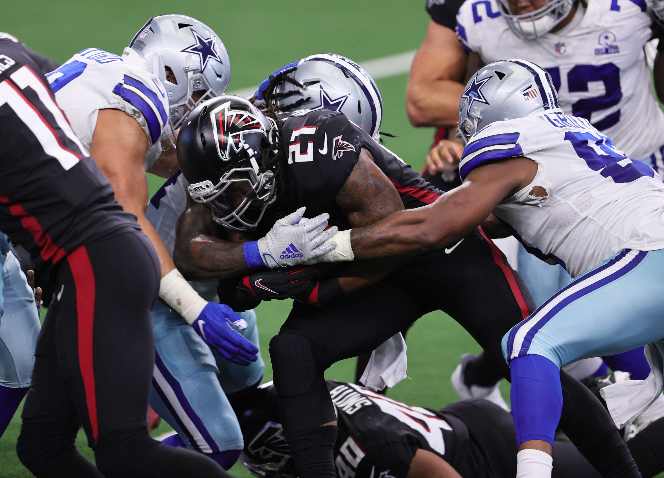 Sep 20, 2020; Arlington, Texas, USA; Atlanta Falcons running back Todd Gurley II (21) runs with the ball in the fourth quarter against the Dallas Cowboys at AT&T Stadium. Mandatory Credit: Matthew Emmons-USA TODAY Sports