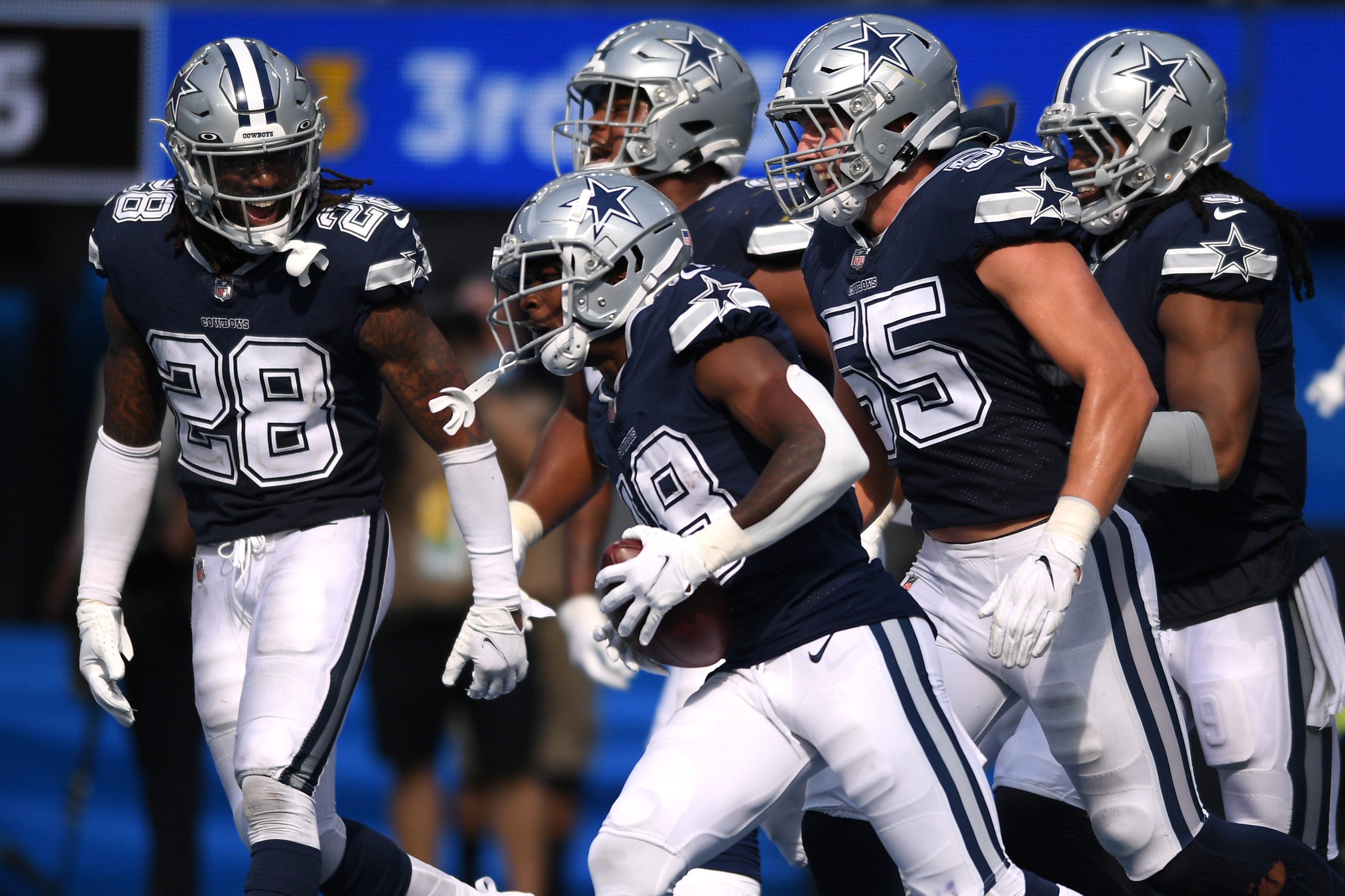 Sep 19, 2021; Inglewood, California, USA; Dallas Cowboys strong safety Damontae Kazee (18) celebrates with teammates after an interception against the Los Angeles Chargers during the second half at SoFi Stadium. Mandatory Credit: Orlando Ramirez-USA TODAY Sports
