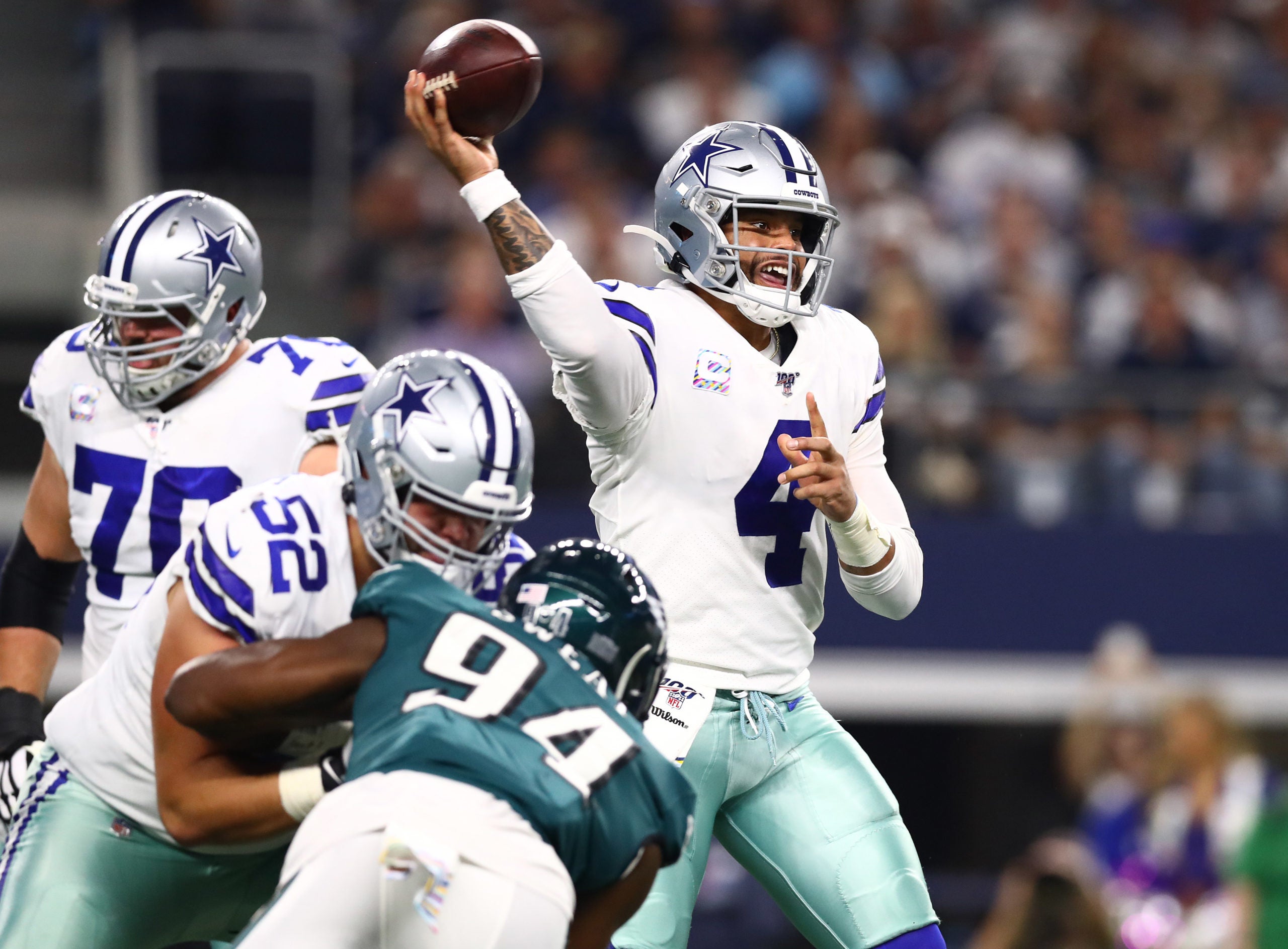 Oct 20, 2019; Arlington, TX, USA; Dallas Cowboys quarterback Dak Prescott (4) throws in the pocket in the first quarter against the Philadelphia Eagles at AT&T Stadium. Mandatory Credit: Matthew Emmons-USA TODAY Sports