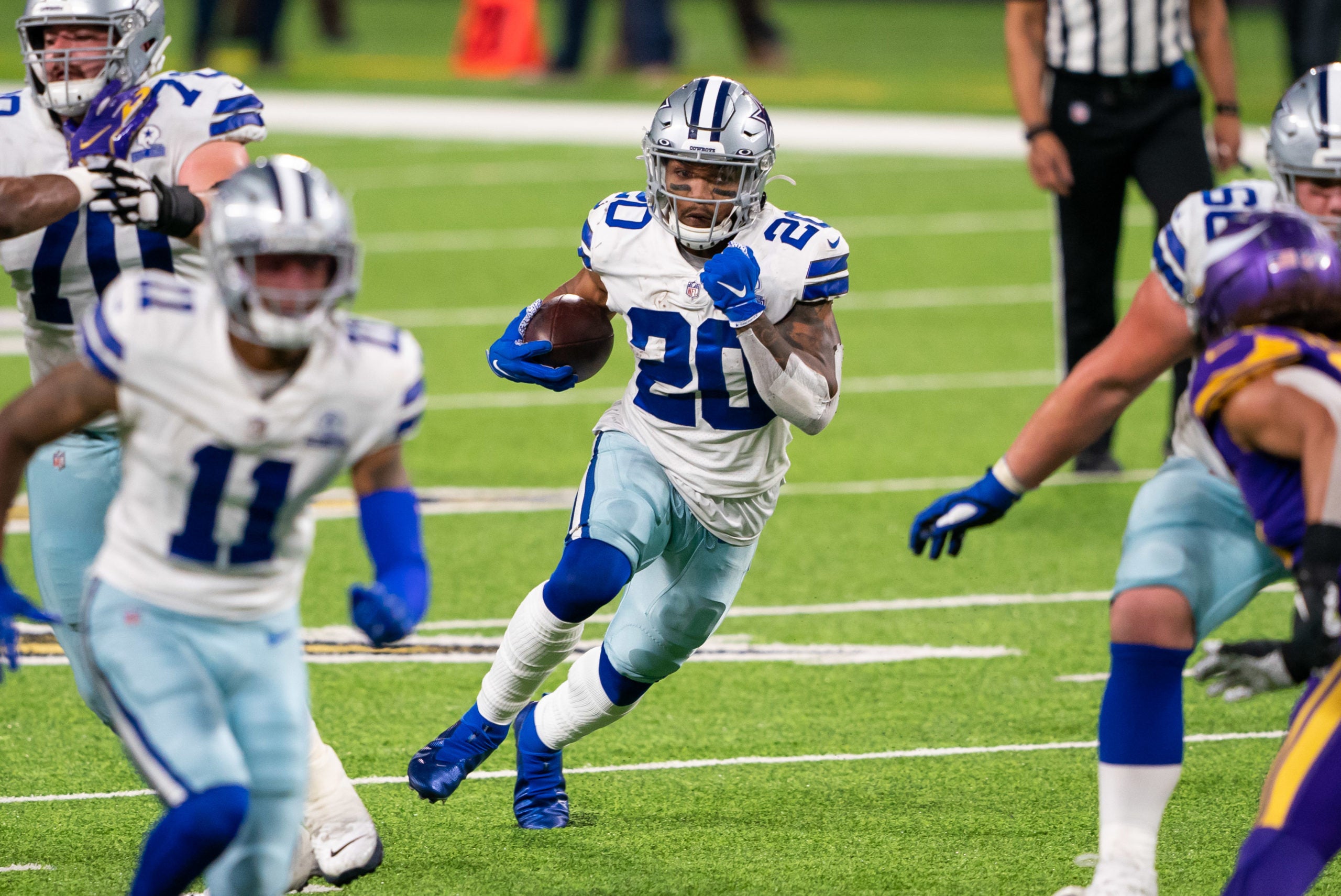 Nov 22, 2020; Minneapolis, Minnesota, USA; Dallas Cowboys running back Tony Pollard (20) runs with the ball in the fourth quarter against the Minnesota Vikings at U.S. Bank Stadium. Mandatory Credit: Brad Rempel-USA TODAY Sports
