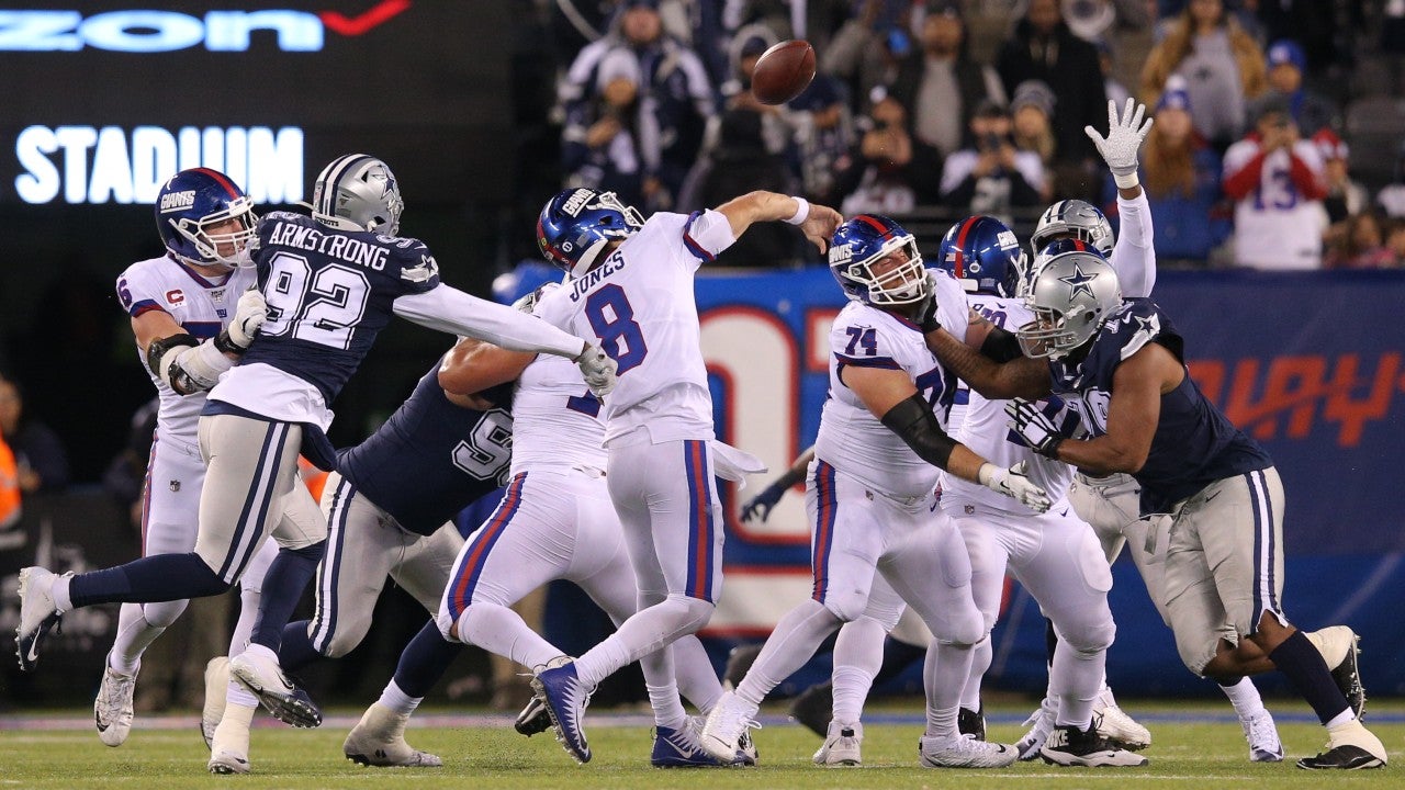 Nov 4, 2019; East Rutherford, NJ, USA; Dallas Cowboys defensive end Dorance Armstrong (92) forces a fumble by New York Giants quarterback Daniel Jones (8) during the fourth quarter at MetLife Stadium. Mandatory Credit: Brad Penner-USA TODAY Sports