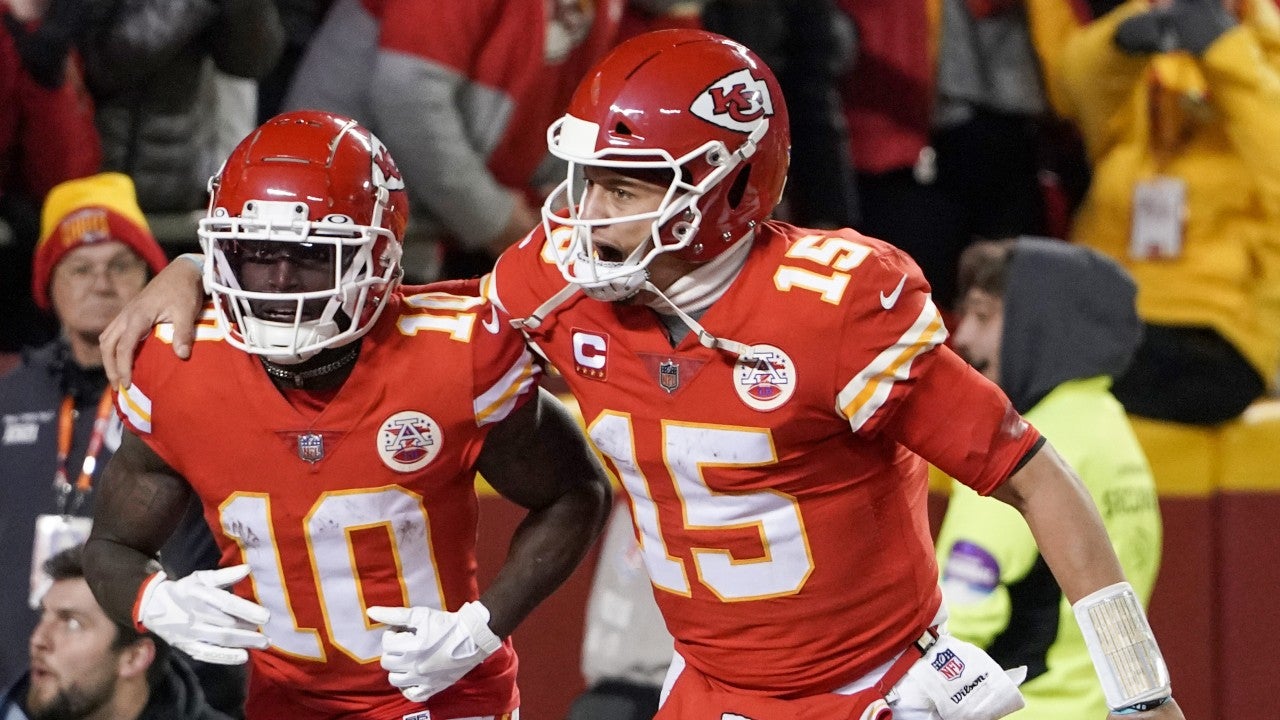 Jan 23, 2022; Kansas City, Missouri, USA; Kansas City Chiefs quarterback Patrick Mahomes (15) celebrates with wide receiver Tyreek Hill (10) after Hill scored against the Buffalo Bills during an AFC Divisional playoff football game at GEHA Field at Arrowhead Stadium. Mandatory Credit: Denny Medley-USA TODAY Sports