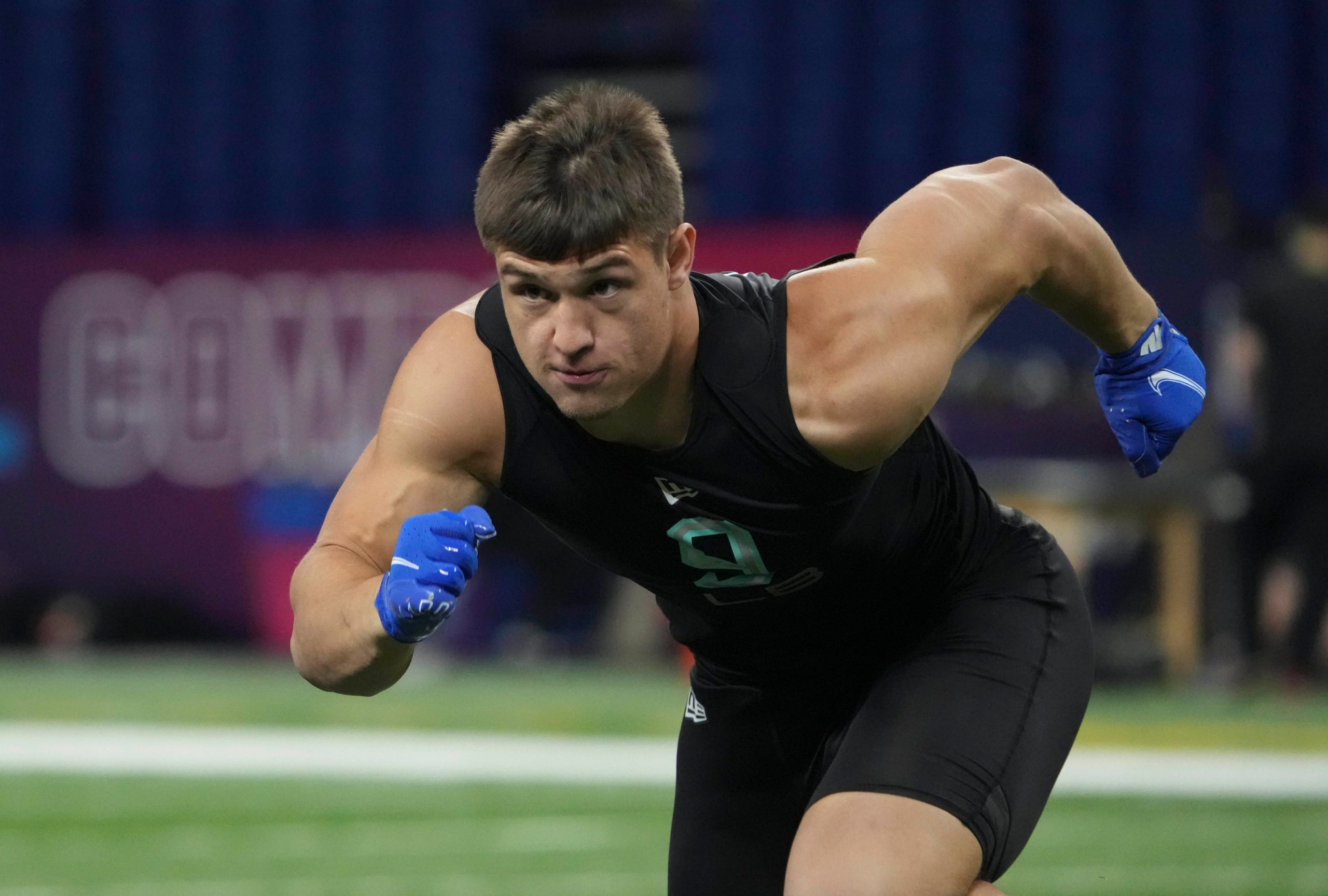 Mar 5, 2022; Indianapolis, IN, USA; Wisconsin linebacker Leo Chenal (LB09) goes through drills during the 2022 NFL Scouting Combine at Lucas Oil Stadium. Mandatory Credit: Kirby Lee-USA TODAY Sports