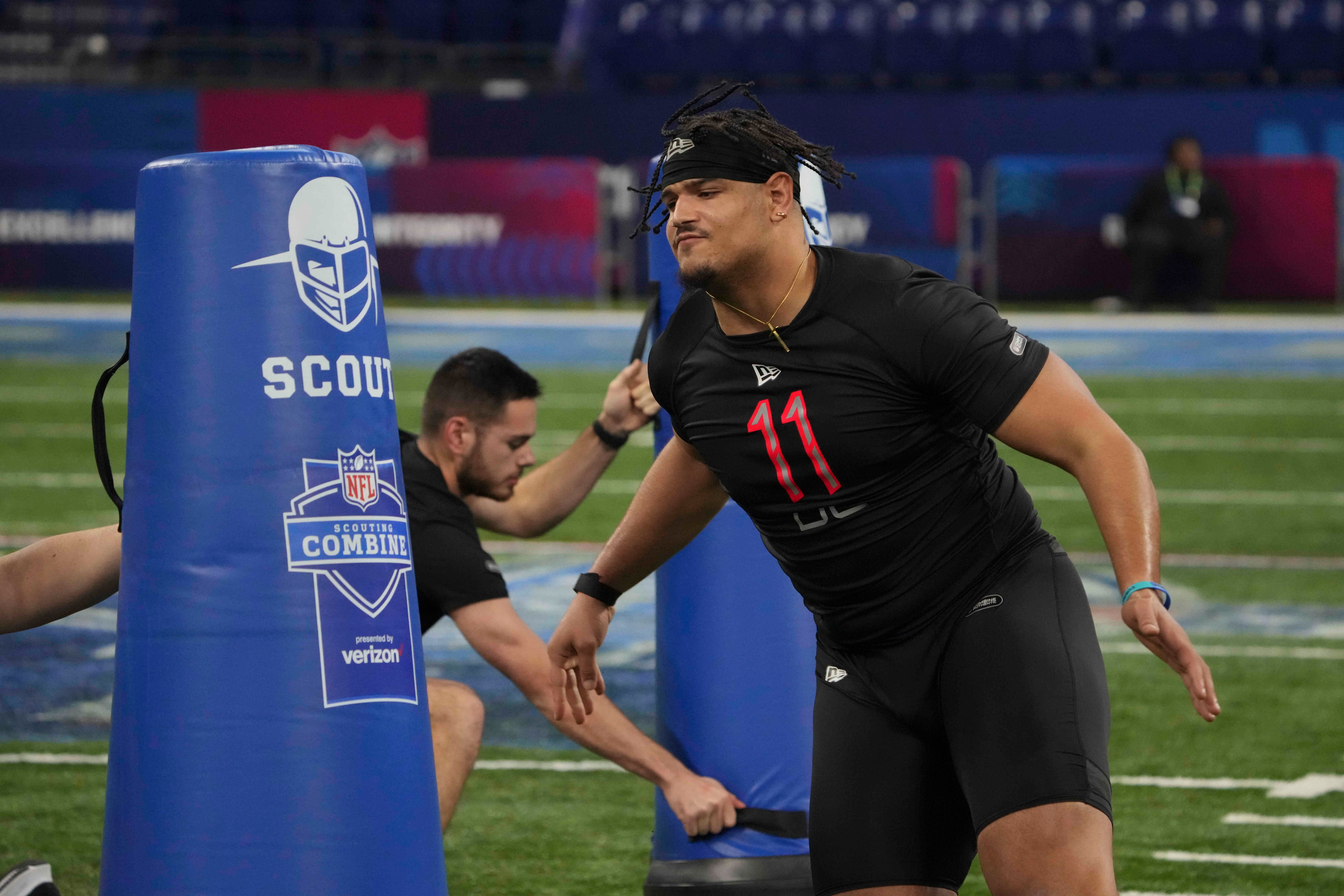 Mar 5, 2022; Indianapolis, IN, USA; Houston defensive lineman Logan Hall (DL11) goes through drills during the 2022 NFL Scouting Combine at Lucas Oil Stadium. Mandatory Credit: Kirby Lee-USA TODAY Sports