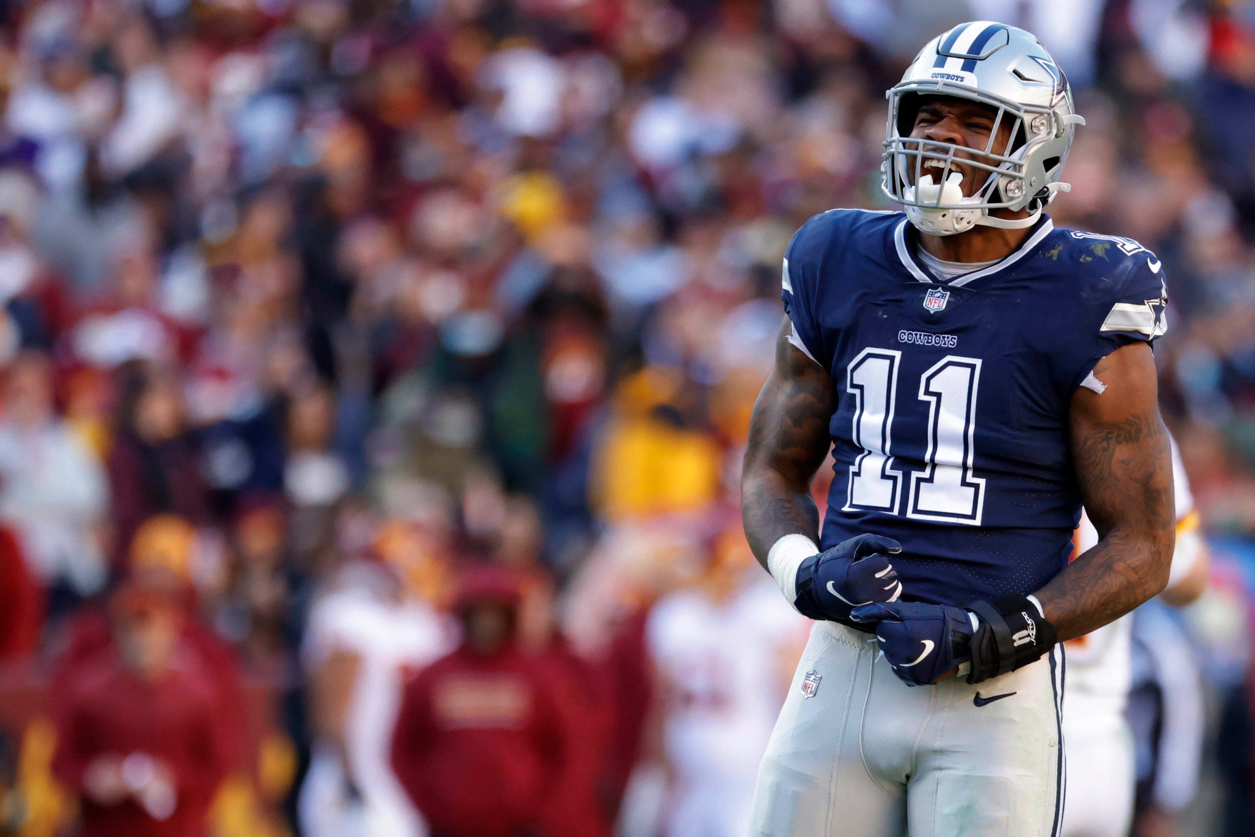 Dec 12, 2021; Landover, Maryland, USA; Dallas Cowboys outside linebacker Micah Parsons (11) celebrates after sacking Washington Football Team quarterback Taylor Heinicke (not pictured) at FedExField. Mandatory Credit: Geoff Burke-USA TODAY Sports