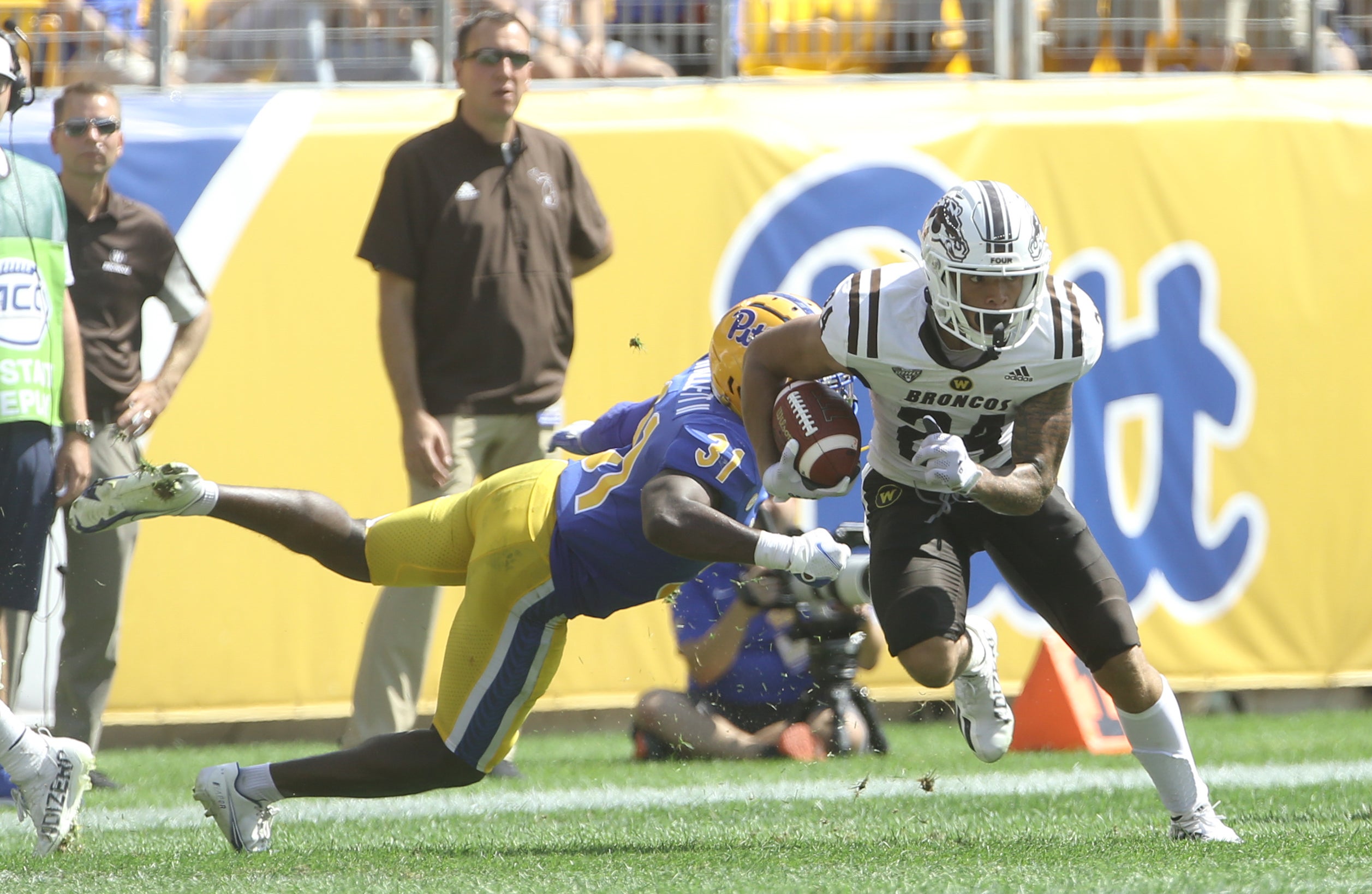 Sep 18, 2021; Pittsburgh, Pennsylvania, USA;  Western Michigan Broncos wide receiver Skyy Moore (24) runs after a pass reception past Pittsburgh Panthers defensive back Erick Hallett (31) during the second quarter at Heinz Field. Mandatory Credit: Charles LeClaire-USA TODAY Sports