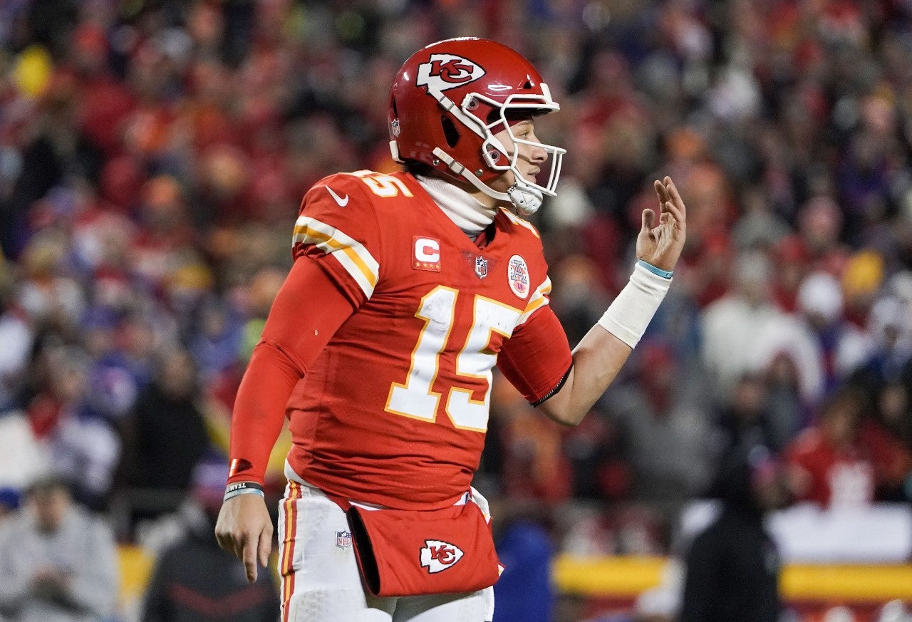 Jan 23, 2022; Kansas City, Missouri, USA; Kansas City Chiefs quarterback Patrick Mahomes (15) gestures toward the sidelines against the Buffalo Bills during an AFC Divisional playoff football game at GEHA Field at Arrowhead Stadium. Mandatory Credit: Denny Medley-USA TODAY Sports