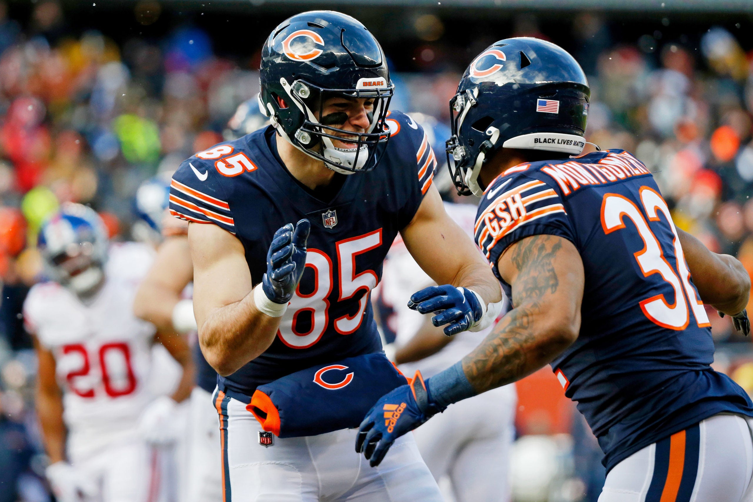 Jan 2, 2022; Chicago, Illinois, USA; Chicago Bears tight end Cole Kmet (85) congratulates running back David Montgomery (32) after he scored a touchdown against the New York Giants during the first half at Soldier Field. Mandatory Credit: Jon Durr-USA TODAY Sports