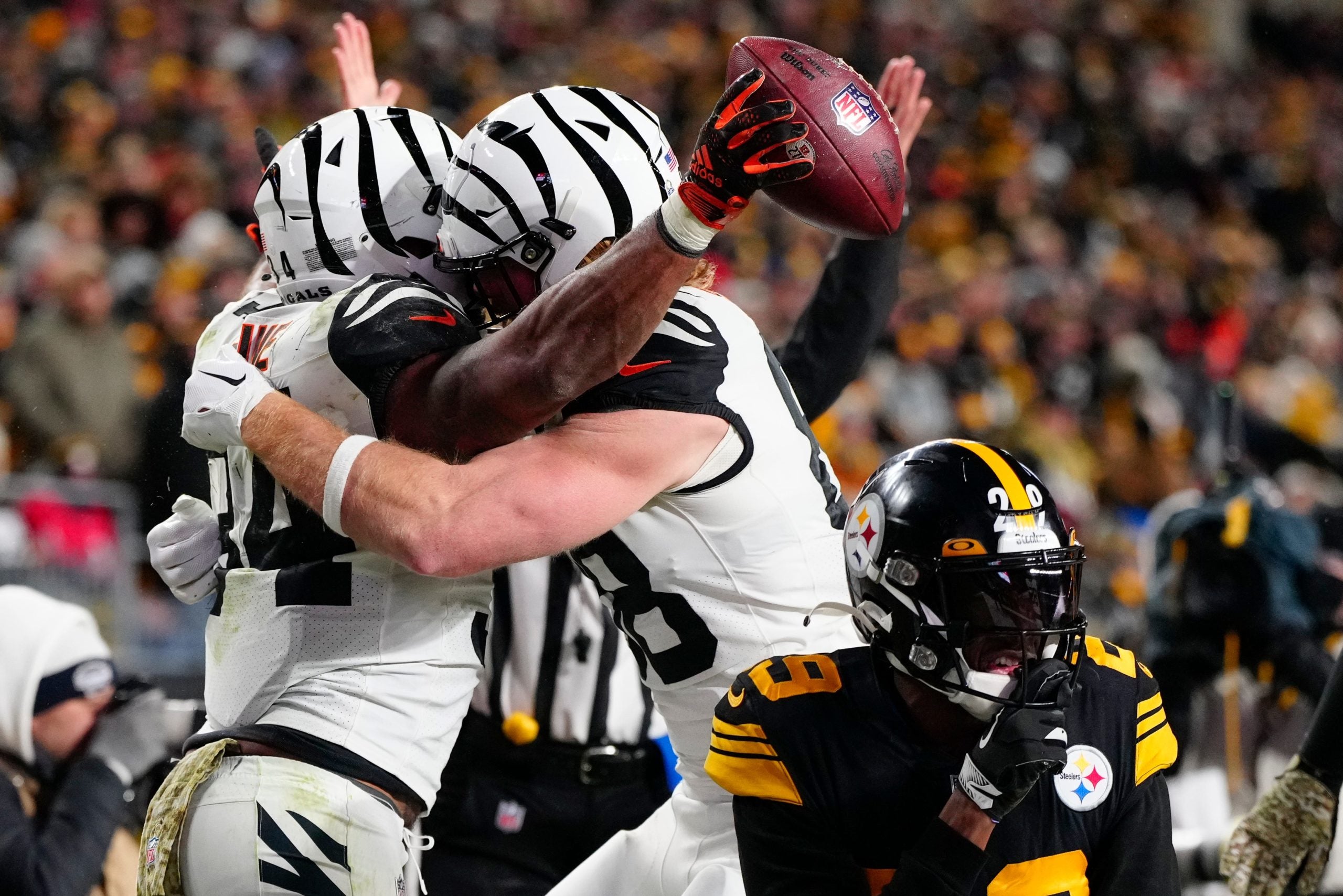 Cincinnati Bengals running back Samaje Perine (34) and tight end Hayden Hurst (88) celebrate Perine’s touchdown in the fourth quarter of of the NFL Week 11 game between the Pittsburgh Steelers and the Cincinnati Bengals at Acrisure Stadium in Pittsburgh on Sunday, Nov. 20, 2022. The Bengals won 37-30. Cincinnati Bengals At Pittsburgh Steelers Week 11