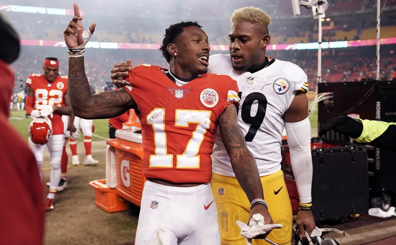 Jan 16, 2022; Kansas City, Missouri, USA; Kansas City Chiefs wide receiver Mecole Hardman (17) and Pittsburgh Steelers wide receiver JuJu Smith-Schuster (right) talk following the AFC Wild Card playoff football game at GEHA Field at Arrowhead Stadium. Mandatory Credit: Denny Medley-USA TODAY Sports