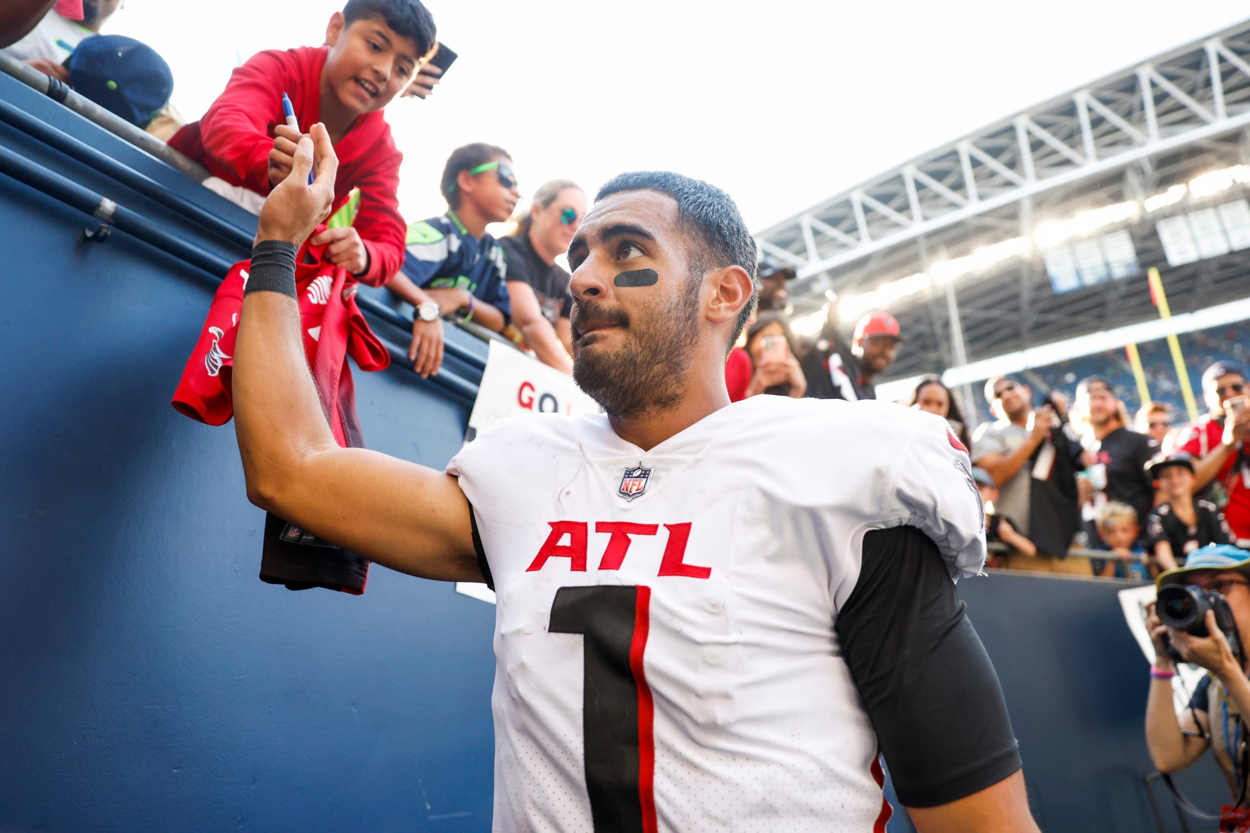Sep 25, 2022; Seattle, Washington, USA; Atlanta Falcons quarterback Marcus Mariota (1) walks to the locker room following a 27-23 victory against the Seattle Seahawks during the fourth quarter at Lumen Field. Mandatory Credit: Joe Nicholson-USA TODAY Sports