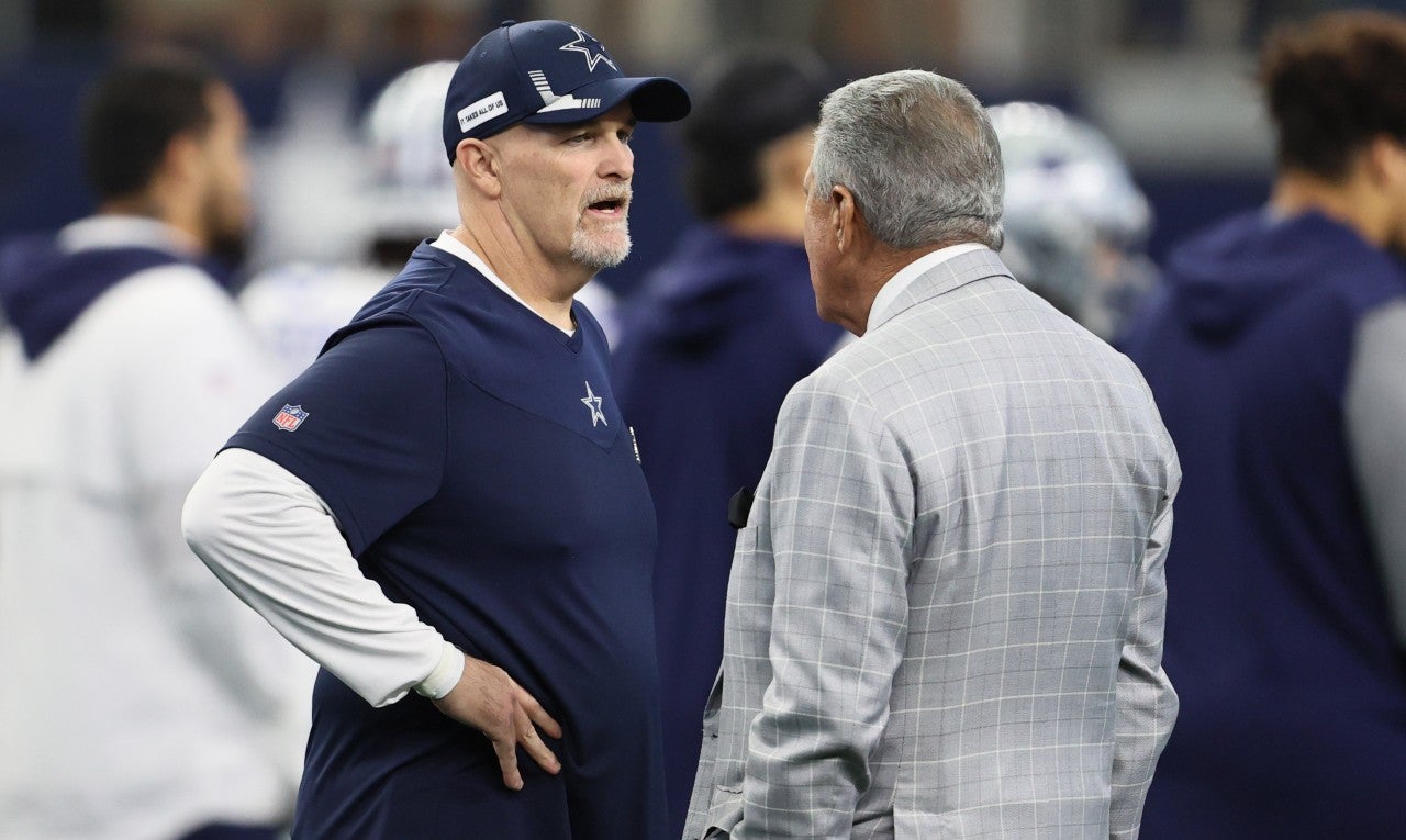 Nov 14, 2021; Arlington, Texas, USA; Atlanta Falcons owner Arthur Blank (right) talks with Dallas Cowboys defensive coordinator Dan Quinn prior to the game at AT&T Stadium. Mandatory Credit: Matthew Emmons-USA TODAY Sports