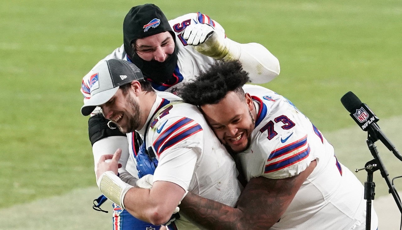Dec 19, 2020; Denver, Colorado, USA; Buffalo Bills quarterback Josh Allen (17) celebrates with teammates Dion Dawkins (73) and Jon Feliciano (76) after game against the Denver Broncos at Empower Field at Mile High. Mandatory Credit: Troy Babbitt-USA TODAY Sports