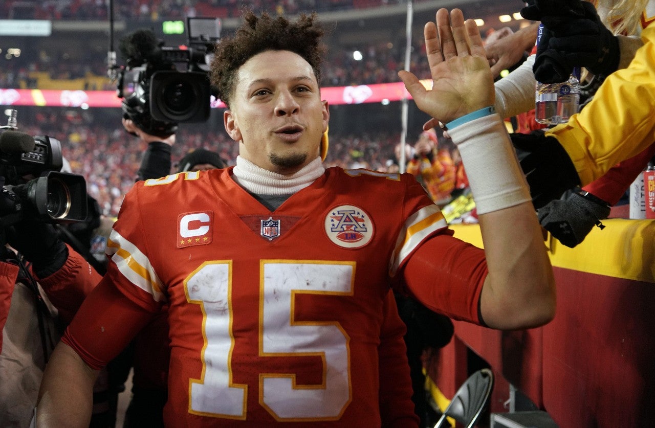 Jan 23, 2022; Kansas City, Missouri, USA; Kansas City Chiefs quarterback Patrick Mahomes (15) celebrates the win against the Buffalo Bills in overtime in the AFC Divisional playoff football game at GEHA Field at Arrowhead Stadium. Mandatory Credit: Denny Medley-USA TODAY Sports