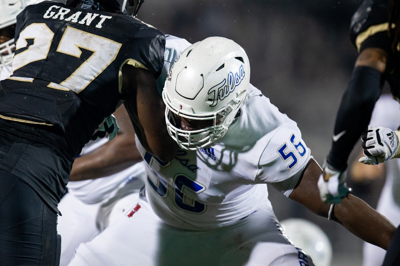 Oct 3, 2020; Orlando, Florida, USA; Tulsa Golden Hurricane offensive tackle Tyler Smith (56) guards during the second quarter of a game against the UCF Knights at Spectrum Stadium. Mandatory Credit: Mary Holt-USA TODAY Sports