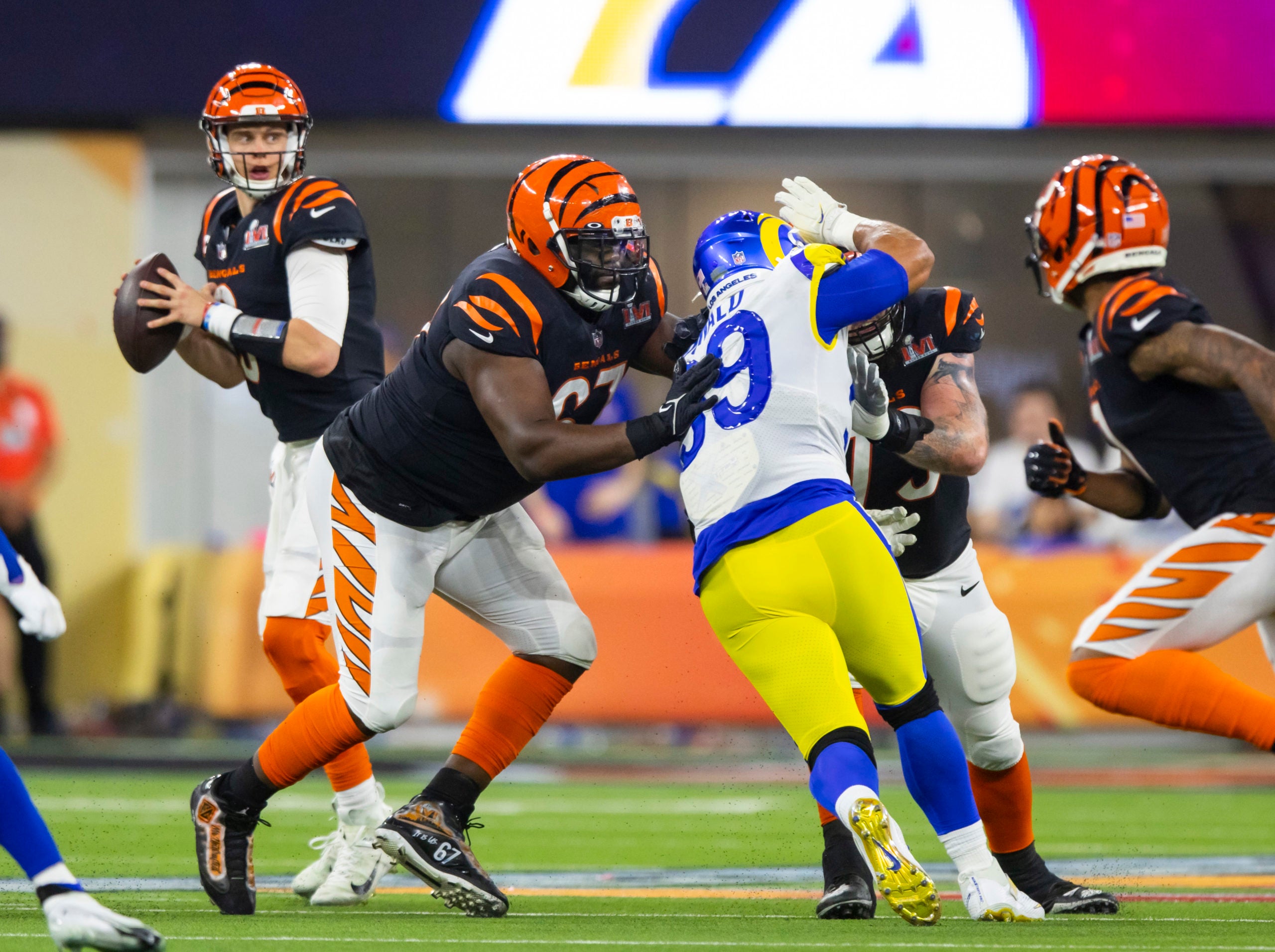 Feb 13, 2022; Inglewood, CA, USA; Cincinnati Bengals guard Quinton Spain (67) blocks for quarterback Joe Burrow (9) against Los Angeles Rams defensive end Aaron Donald (99) during Super Bowl LVI at SoFi Stadium. Mandatory Credit: Mark J. Rebilas-USA TODAY Sports