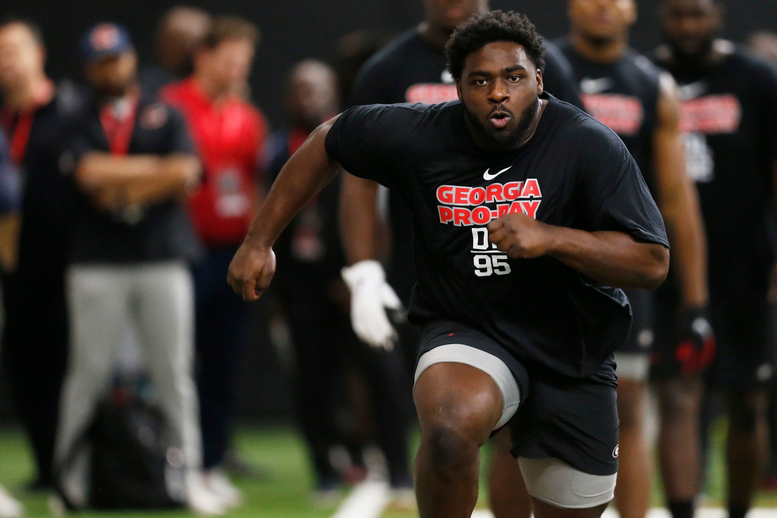 Georgia defensive lineman Devonte Wyatt (95) runs a drill during Georgia's Pro Day in Athens, Ga., on Wednesday, March 16, 2022. News Joshua L Jones