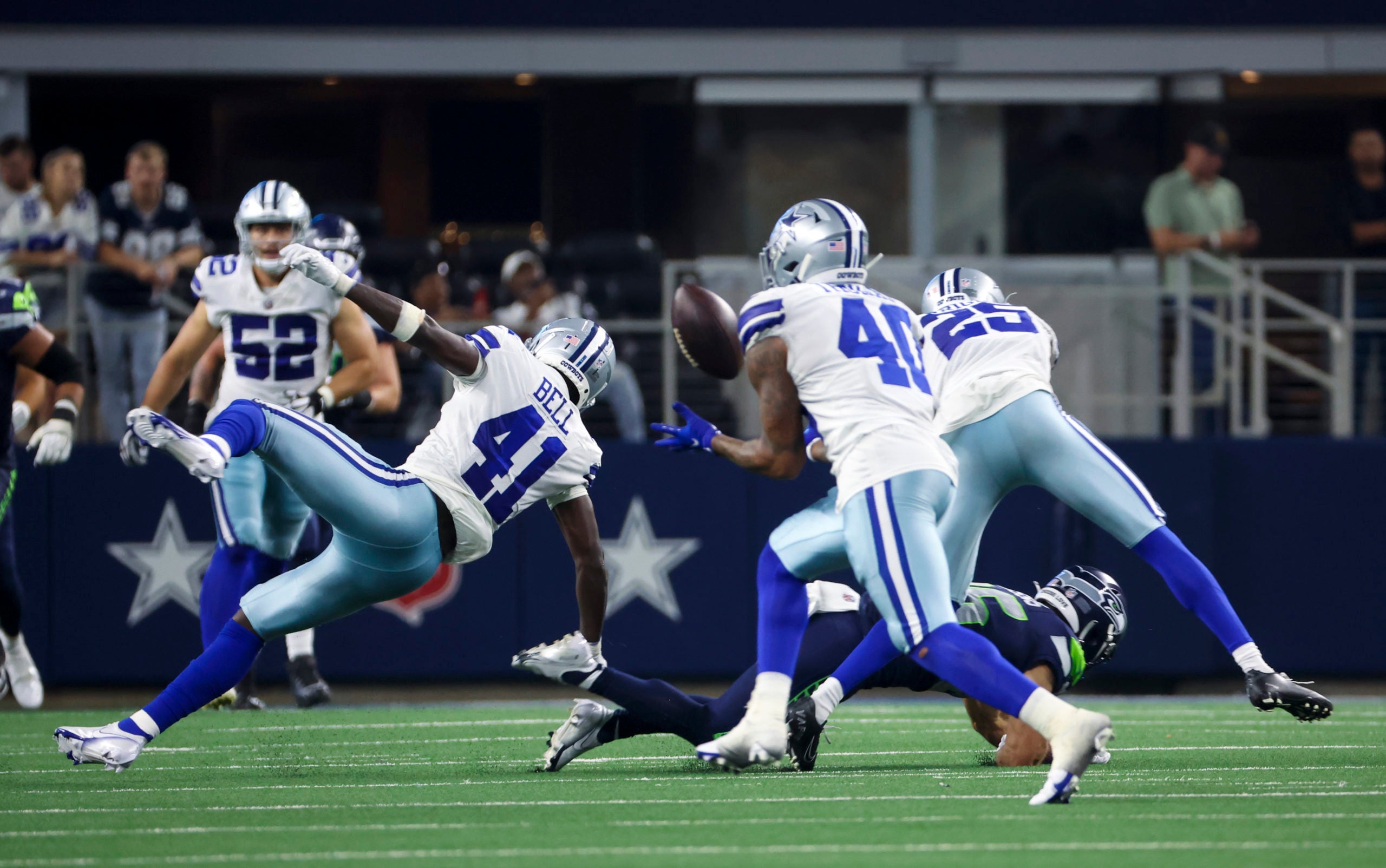 Aug 26, 2022; Arlington, Texas, USA; Dallas Cowboys safety Juanyeh Thomas (40) makes an interception during the fourth quarter against the Seattle Seahawks at AT&T Stadium. Mandatory Credit: Kevin Jairaj-USA TODAY Sports