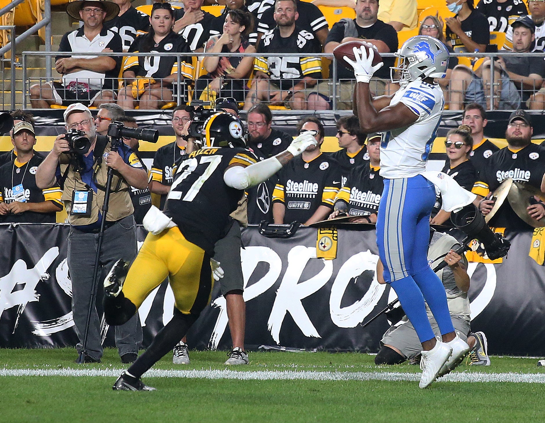 Aug 21, 2021; Pittsburgh, Pennsylvania, USA;   Detroit Lions wide receiver Javon McKinley (83) catches a pass for a touchdown against Pittsburgh Steelers linebacker Marcus Allen (27) during the fourth quarter at Heinz Field. Pittsburgh won 26-20. Mandatory Credit: Charles LeClaire-USA TODAY Sports