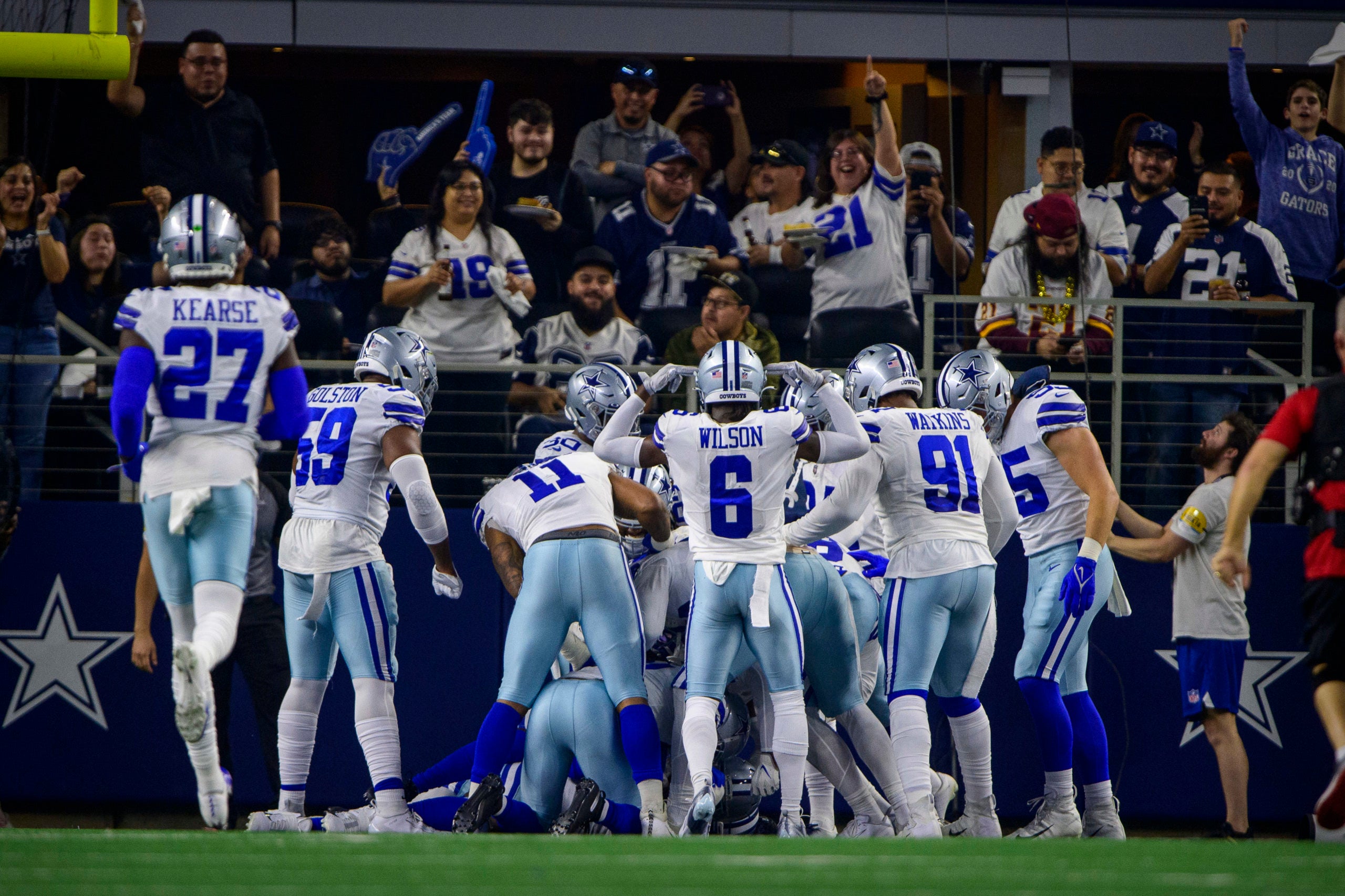 Dec 26, 2021; Arlington, Texas, USA;  The Dallas Cowboys and their fans celebrate a touchdown scored by defensive end Demarcus Lawrence (90) against the Washington Football Team during the first quarter at AT&T Stadium. Mandatory Credit: Jerome Miron-USA TODAY Sports