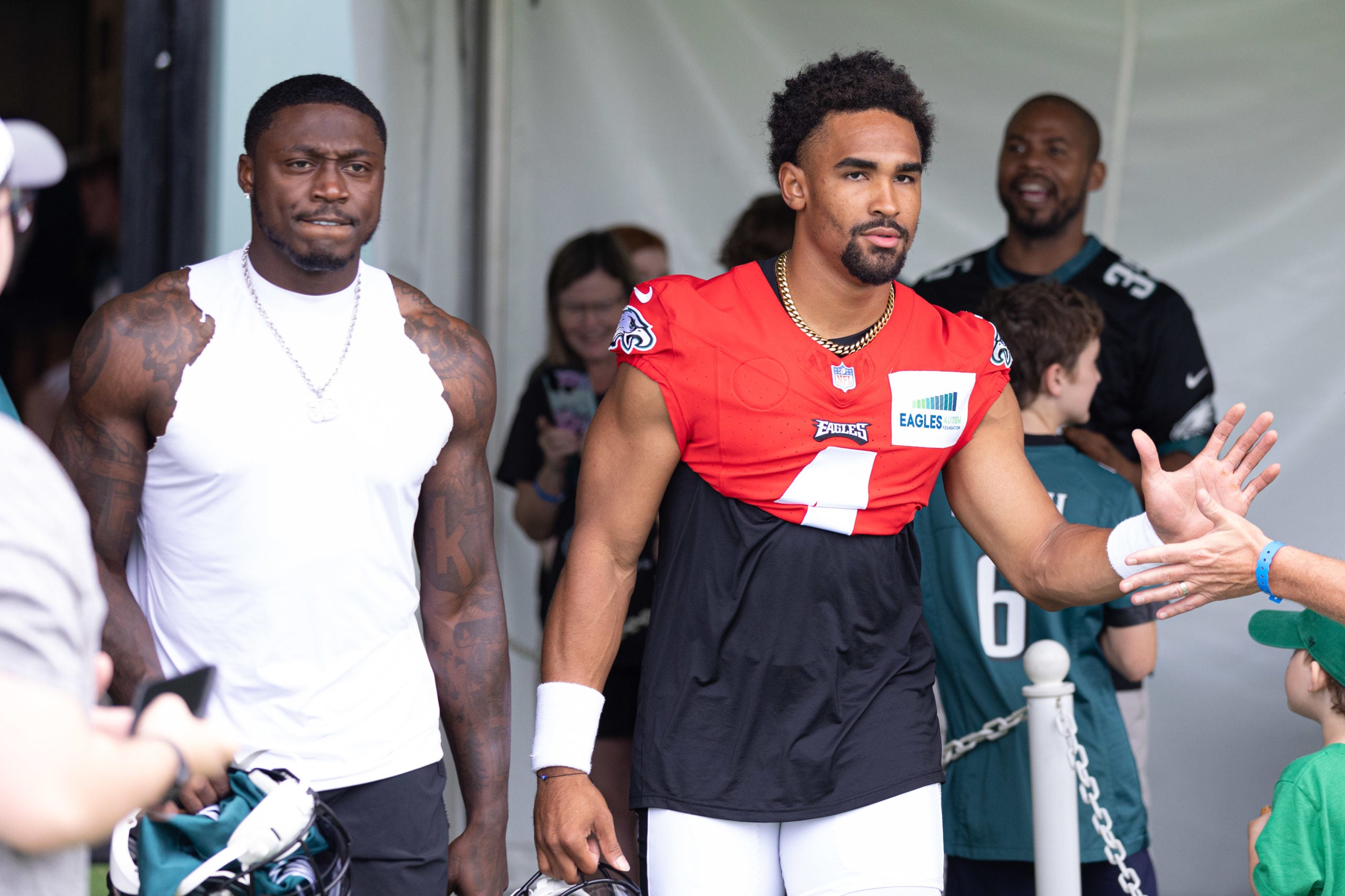 Philadelphia Eagles quarterback Jalen Hurts (1) and wide receiver A.J. Brown (L) walk out of a locker room for training camp at NovaCare Complex