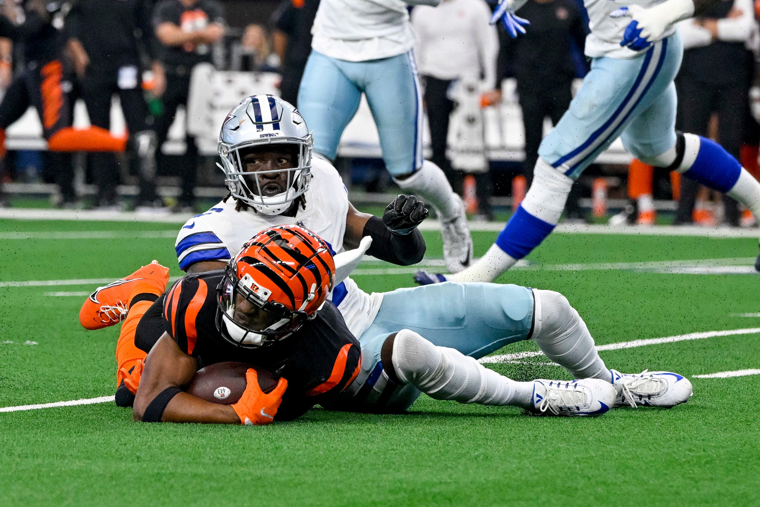 Sep 18, 2022; Arlington, Texas, USA; Cincinnati Bengals wide receiver Ja'Marr Chase (1) and Dallas Cowboys safety Donovan Wilson (6) in action during the game between the Dallas Cowboys and the Cincinnati Bengals at AT&T Stadium. Mandatory Credit: Jerome Miron-USA TODAY Sports
