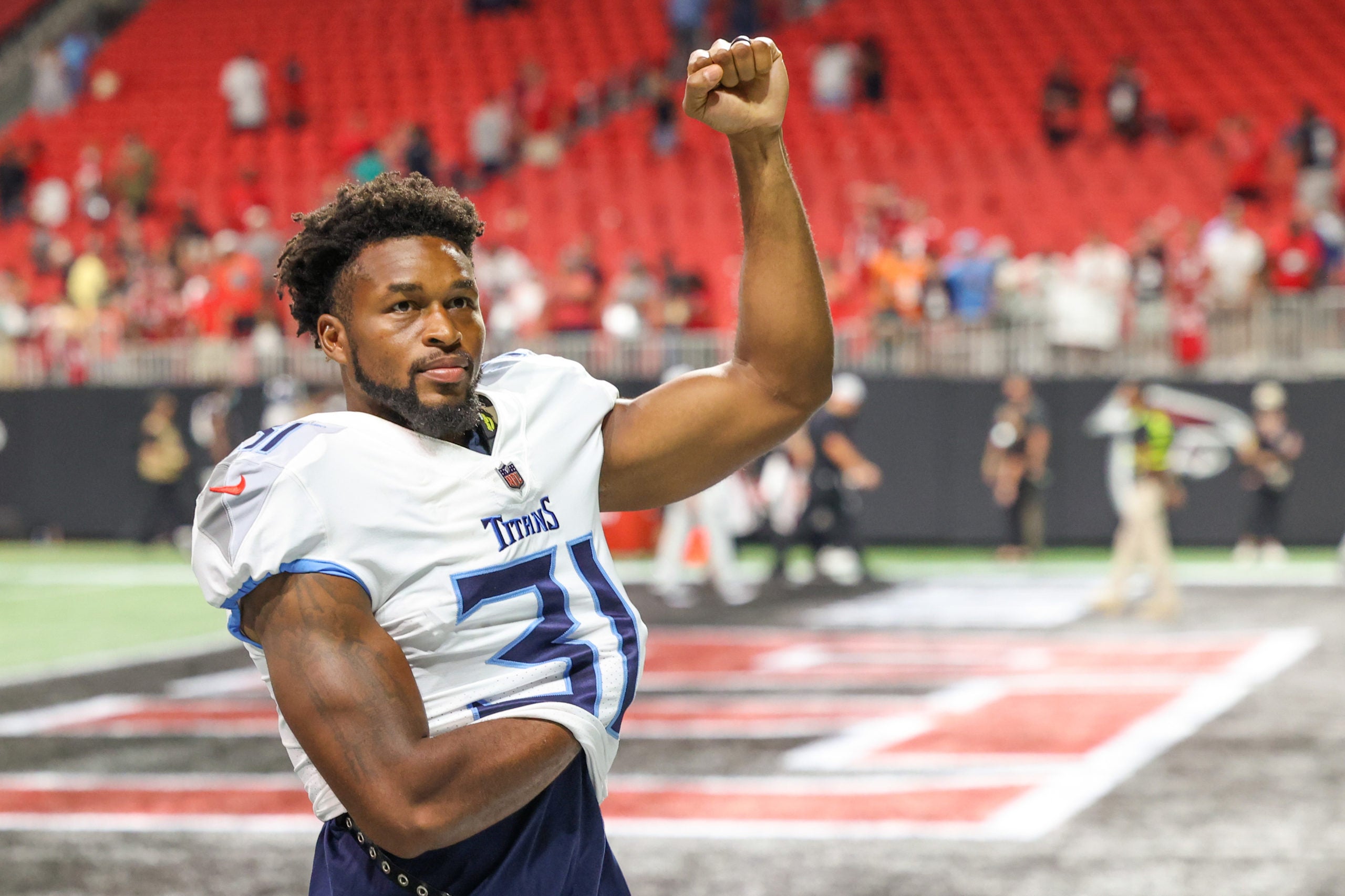 Aug 13, 2021; Atlanta, Georgia, USA; Tennessee Titans safety Kevin Byard (31) reacts to their win as he walks off of the field after their game against the Atlanta Falcons at Mercedes-Benz Stadium. Mandatory Credit: Jason Getz-USA TODAY Sports